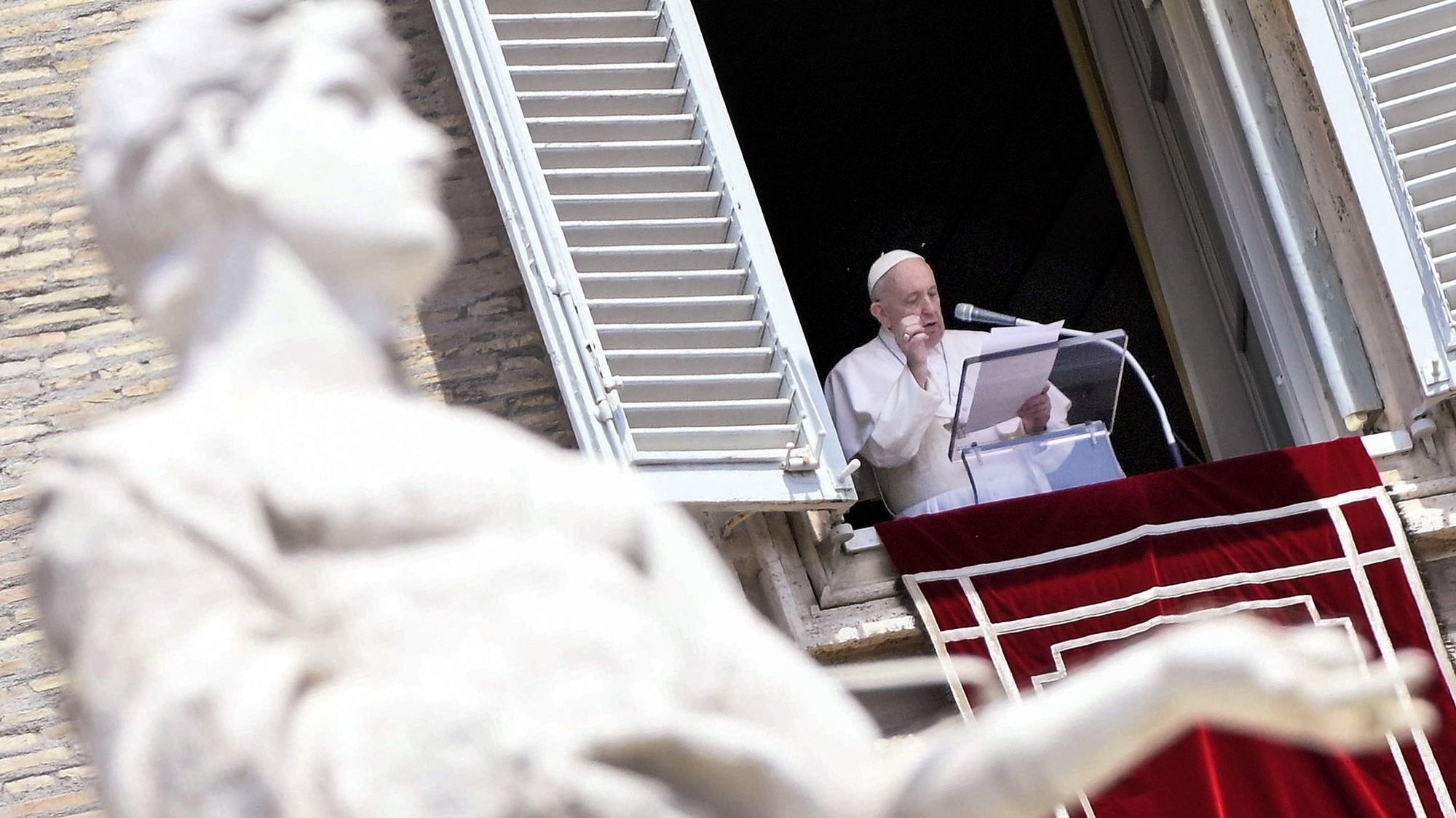epa09266722 Pope Francis leads his Sunday Angelus prayer from the window of his office overlooking Saint Peter&#039;s Square, Vatican City, 13 June 2021.  EPA/CLAUDIO PERI