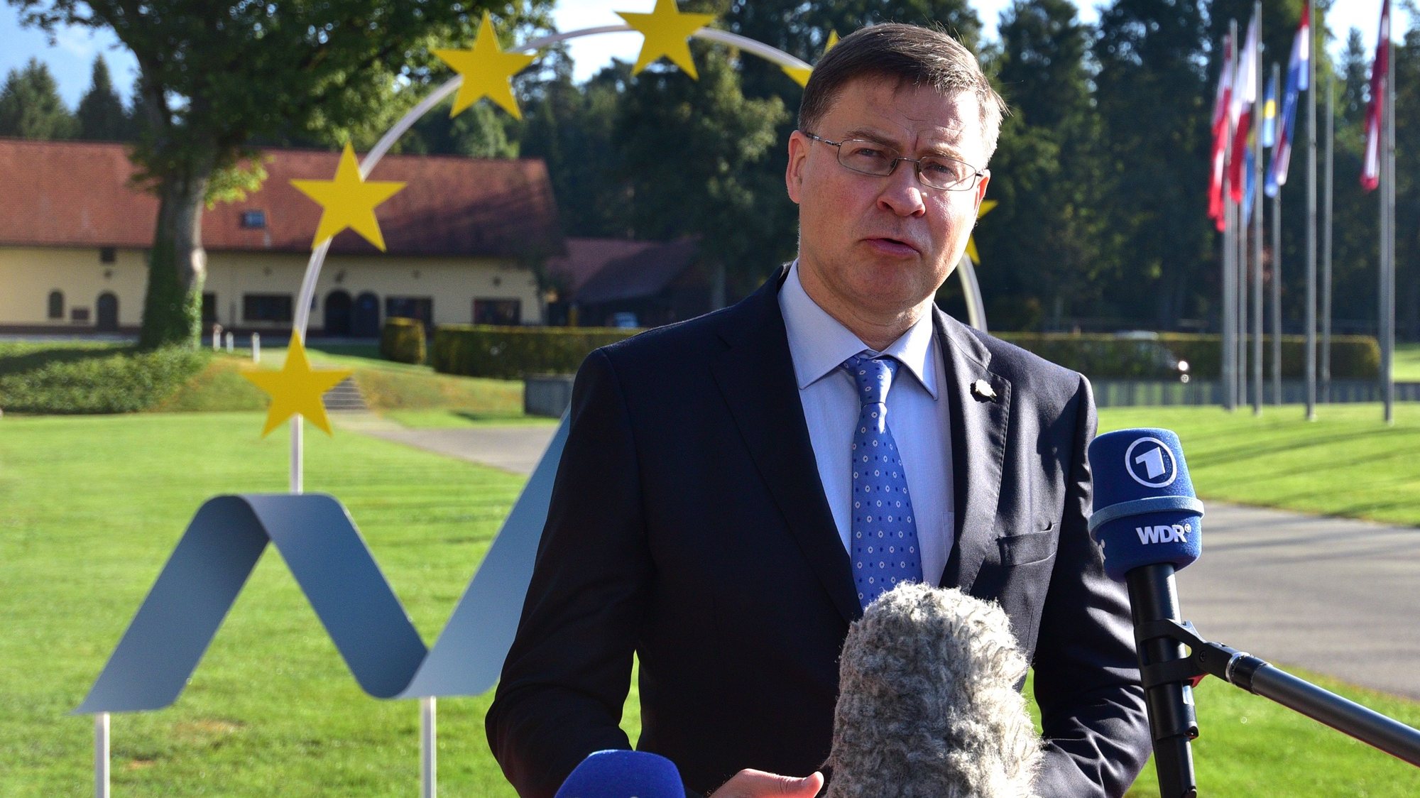 epa09459057 European Commission Executive Vice President Valdis Dombrovskis speaks before an Informal meeting of EU Ministers for Economic and Financial Affairs, at the Kongresni center Brdo, Predoslje, Slovenia, 10 September 2021. Slovenia is hosting a two-day Informal Meeting of EU Ministers for Economic and Financial Affairs.  EPA/IGOR KUPLJENIK