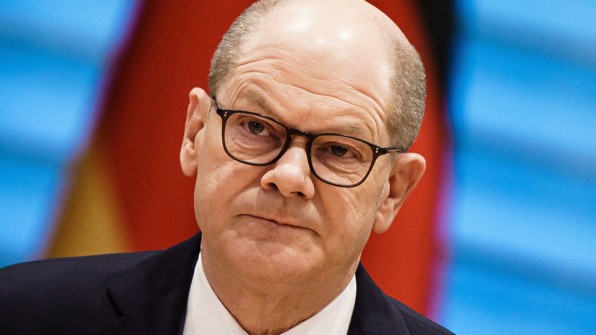 epa09807517 German Chancellor Olaf Scholz, wearing glasses, looks on at the beginning of a security cabinet meeting in Berlin, Germany, 07 March 2022.  EPA/CLEMENS BILAN / POOL