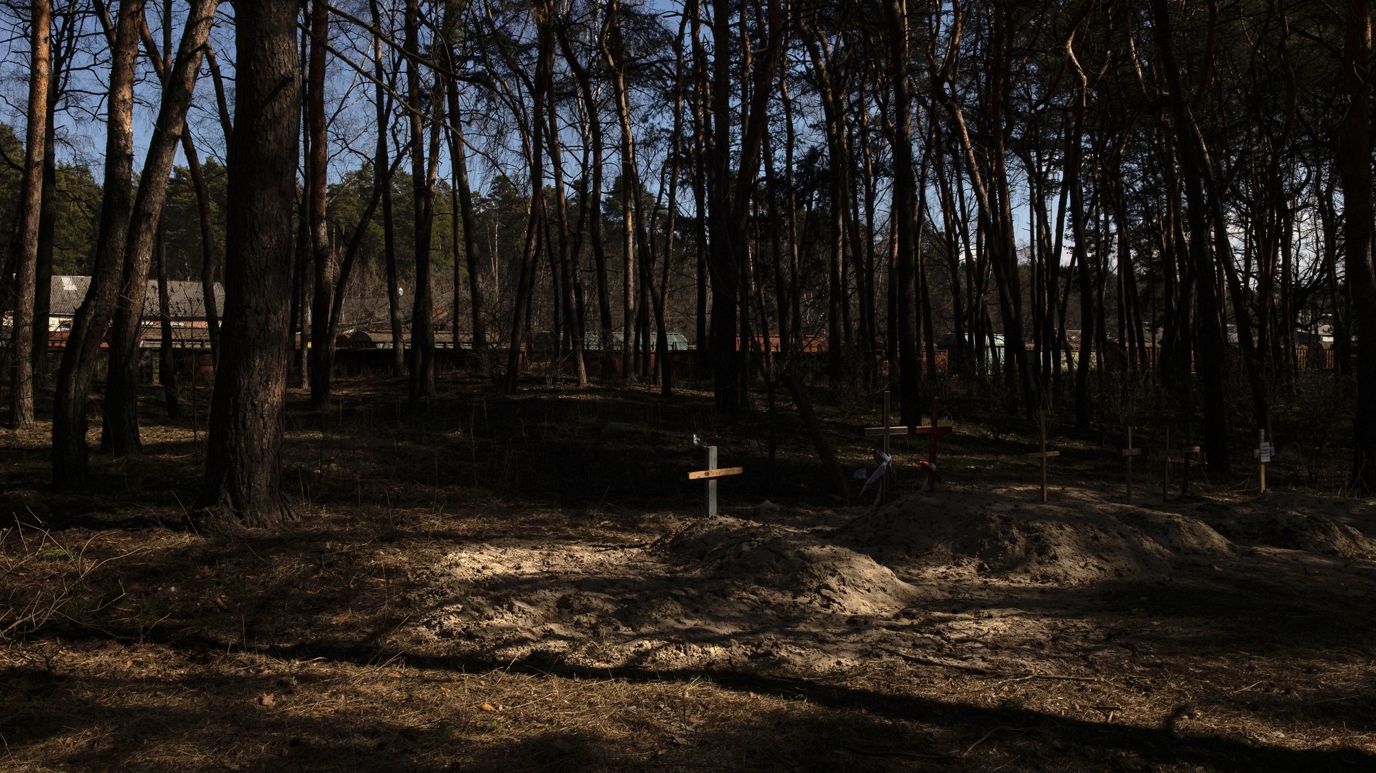 epa09860887 A handmade cross stands in the residential area on a makeshift grave for a civilian killed during the Russian invasion in Trostyanets town, Sumy region, Ukraine, 29 March 2022 (issued 30 March 2022). Trostyanets was recaptured by the Ukrainian army after the town was under the control of Russian forces for over a month following the invasion on 24 February. The local residents claim that Russian soldiers were not letting bury the dead people, forcing many to leave their homes to move into those houses, and were looting in the town. Locals were saying that some of the town&#039;s residents were killed by Russian soldiers. When the Russian army was withdrawing from Trostyanets they stole many cars from local people, as well as different electronic devices.