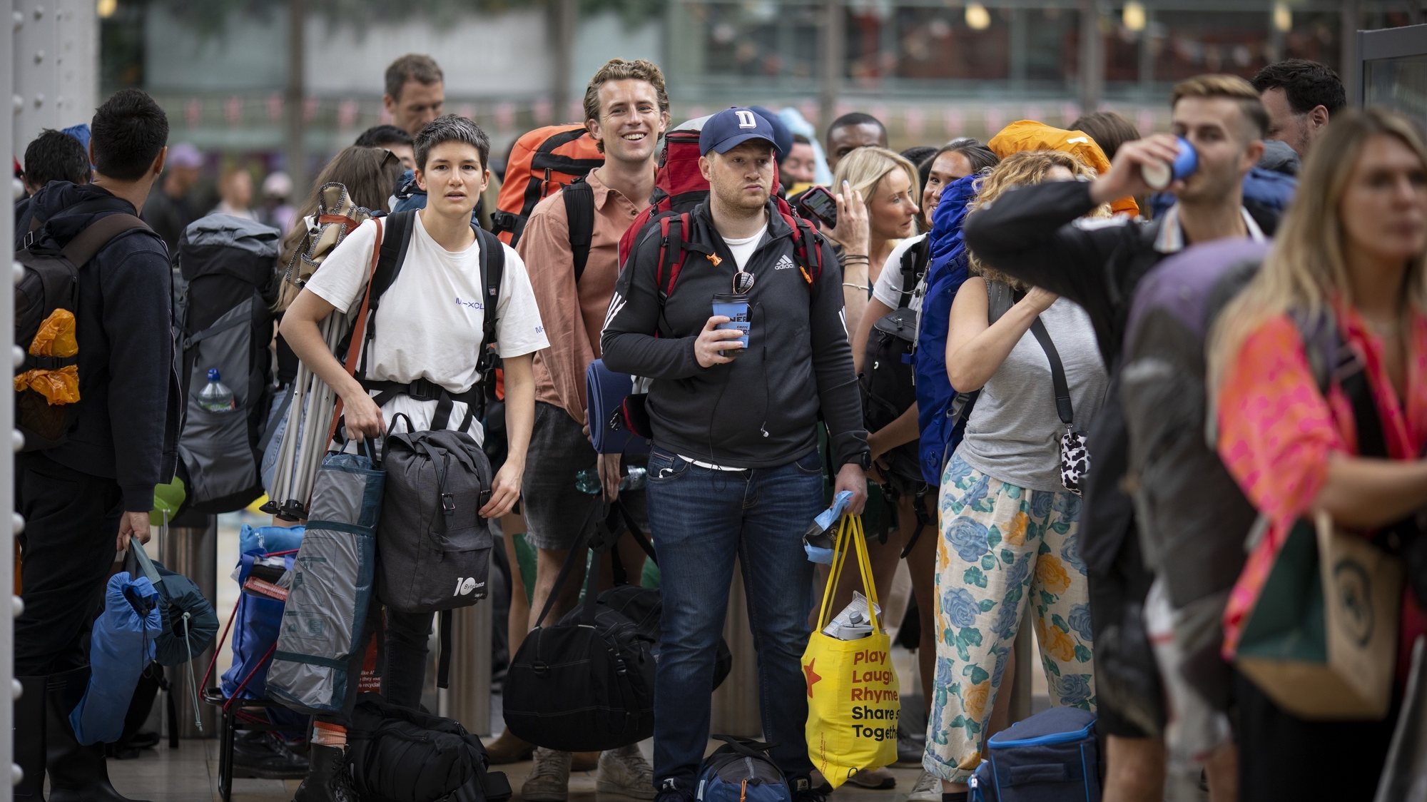 epa10029601 Passengers travel to Glastonbury Festival from Paddington station during a national train strike in London, Britain, 23 June 2022. Britain is facing the second day of train strike as part of the biggest national rail strike in 30 years, crippling the transport network for millions in the UK.  EPA/TOLGA AKMEN