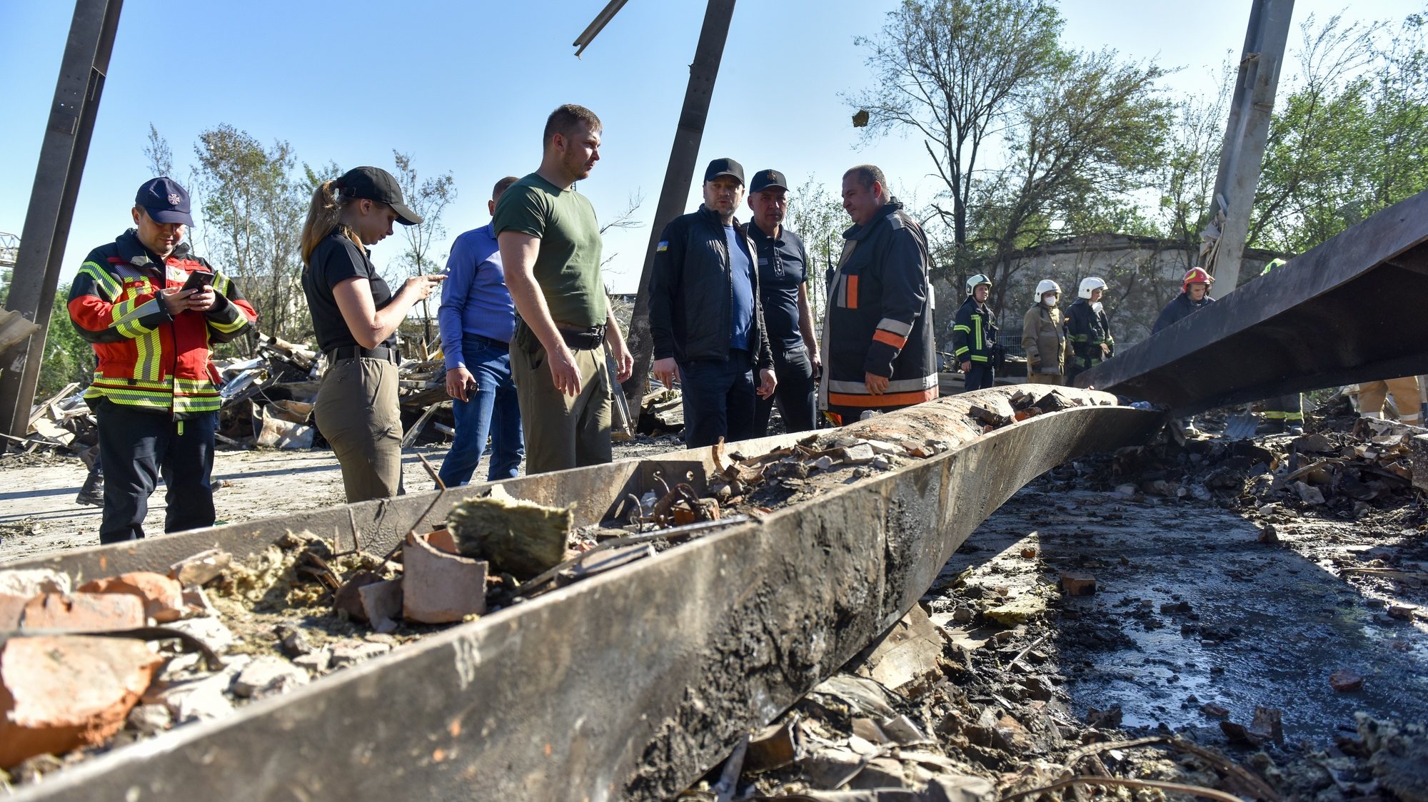 epa10037749 Ukraine&#039;s Minister of Internal Affairs Denys Monastyrsky (3-R) visits the site of destroyed Amstor shopping mall in Kremenchuk, Poltava Oblast, Ukraine, 28 June 2022. At least eighteen people died and at least 58 others were injured following Russian airstrikes on the crowded shopping mall, the State Emergency Service (SES) of Ukraine said in a Telegram post. The one-story building of a shopping center was hit by Russian rockets in the afternoon.  EPA/OLEG PETRASYUK