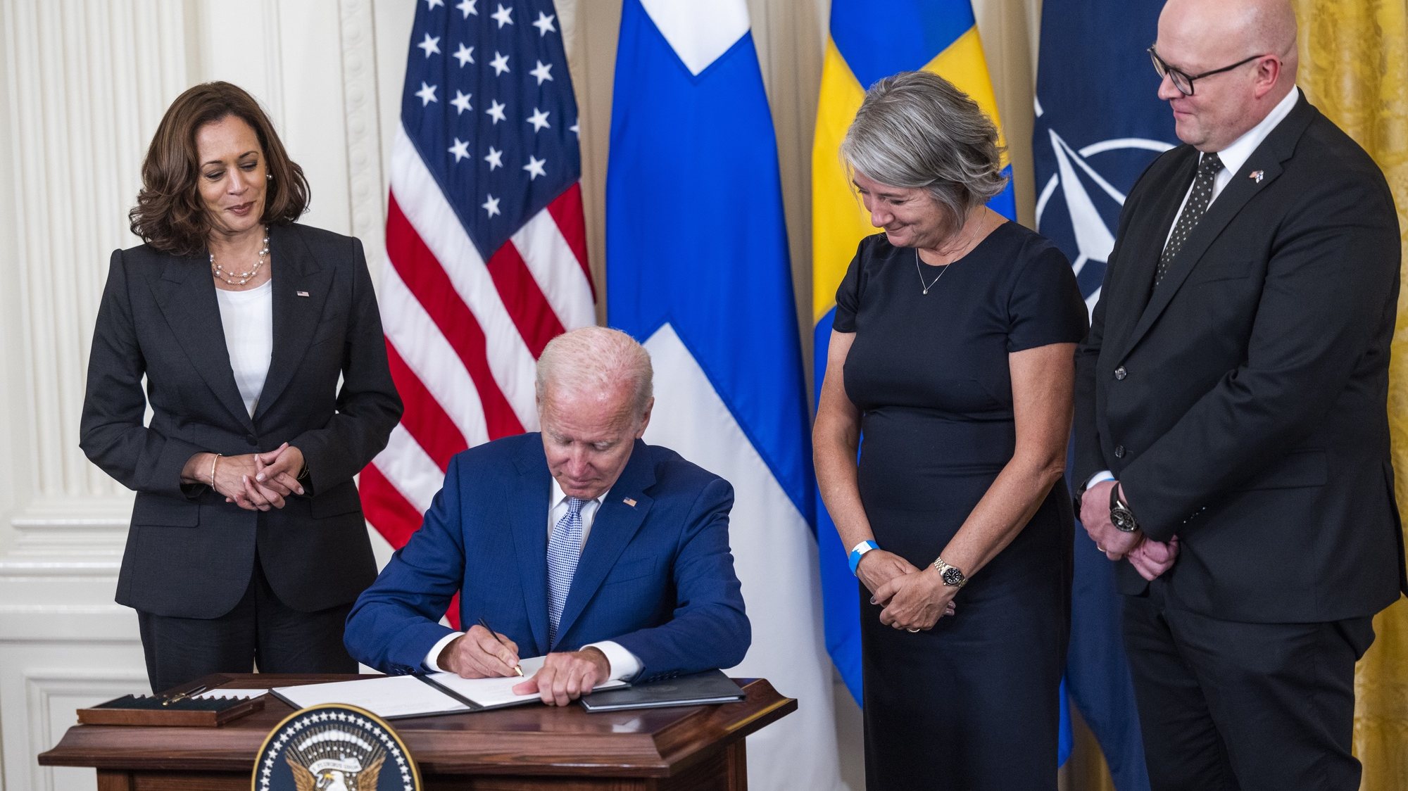 epa10113031 US President Joe Biden (C-L), alongside Vice President Kamala Harris (L), Swedish Ambassador to the US Karin Ulrika Olofsdotter (C-R), and Finnish Ambassador to the US Mikko Hautala (R), signs the Instruments of Ratification for the Accession Protocols to the North Atlantic Treaty (NATO) for Finland and Sweden in the East Room of the White House in Washington, DC, USA, 09 August 2022. The two Nordic countries are seeking to join NATO following Russia&#039;s invasion of Ukraine.  EPA/JIM LO SCALZO