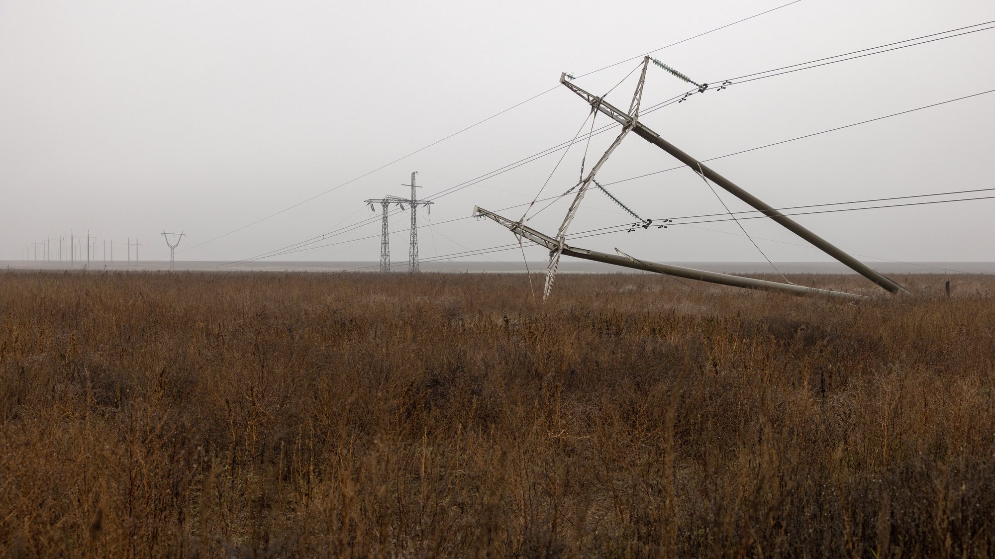 epa10331797 A damaged power line outside Kherson, southern Ukraine, 26 November 2022 (issued 27 November 2022). The Ukrainian president accused the Russian army of deliberately destroying critical infrastructure during their withdrawal from the city of Kherson, including electricity and water supplies. Ukrainian troops entered Kherson on 11 November after the Russian army had withdrawn from the city which they captured in the early stage of the conflict, shortly after Russian troops had entered Ukraine in February 2022.  EPA/ROMAN PILIPEY
