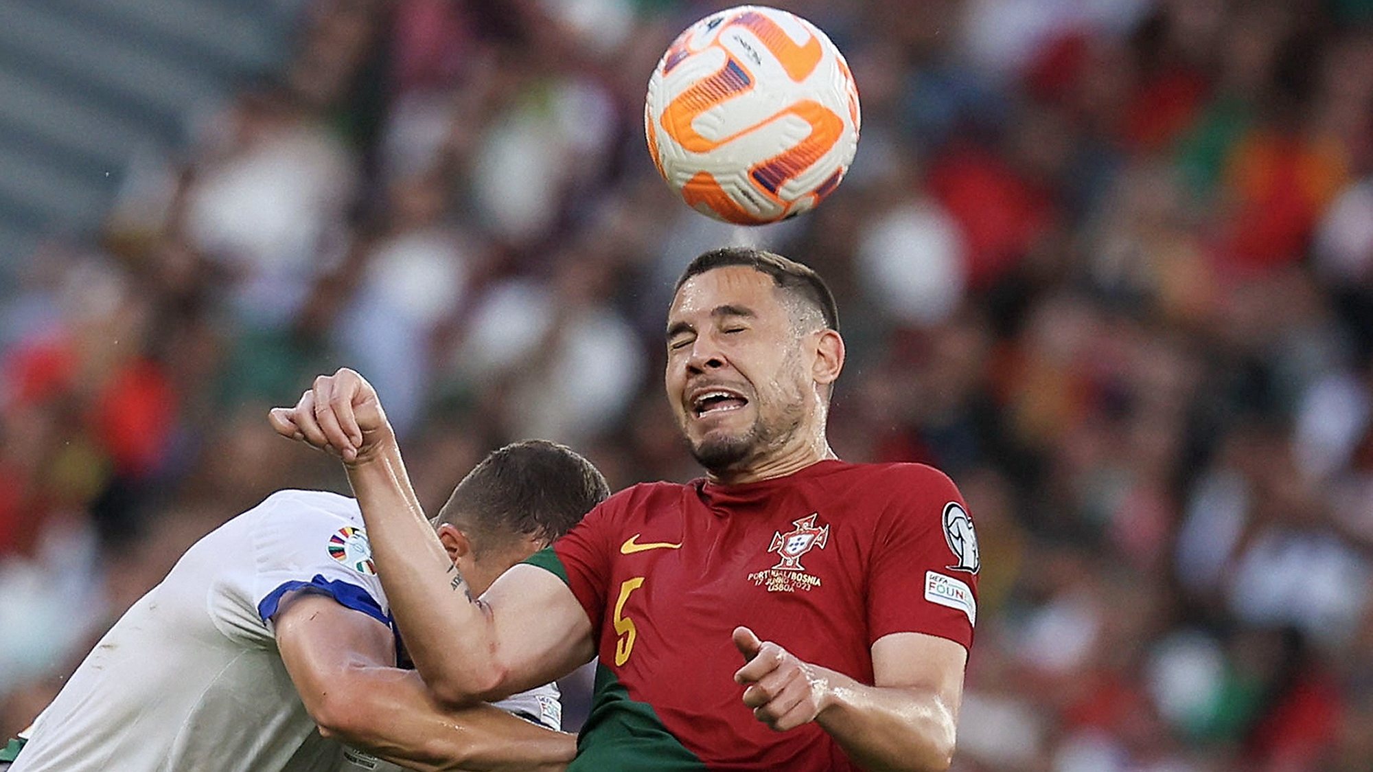 epa10697286 Portugal player Raphael Guerreiro (R) in action during the UEFA Euro 2024 qualifying soccer match between Portugal and against Bosnia-Herzegovina in Lisbon, Portugal, 17 June 2023.  EPA/MANUEL DE ALMEIDA