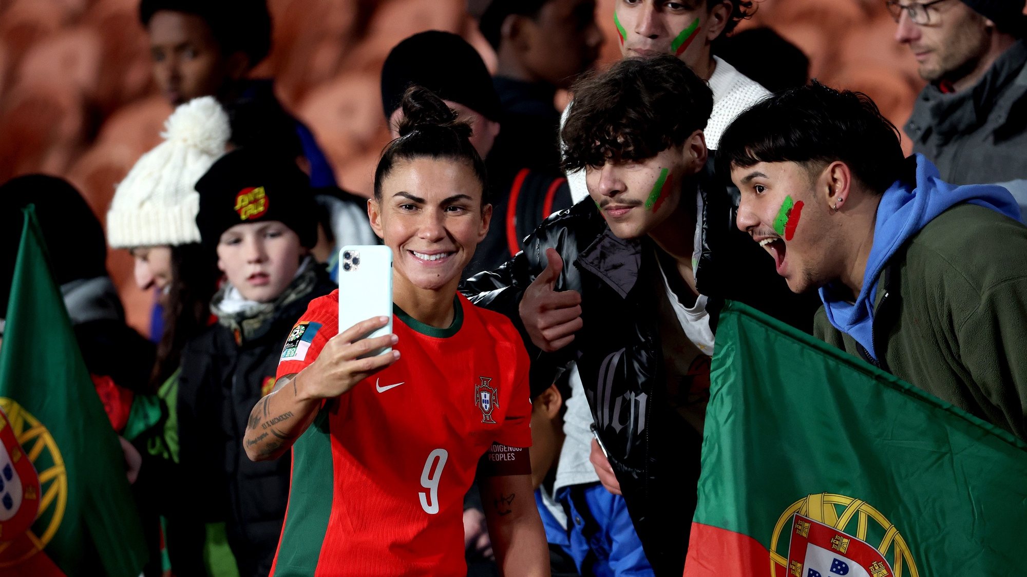 epa10771096 Ana Borges of Portugal takes a selfie with supporters after winning the FIFA Women&#039;s World Cup group E soccer match between Portugal and Vietnam, in Hamilton, New Zealand, 27 July 2023.  EPA/HOW HWEE YOUNG