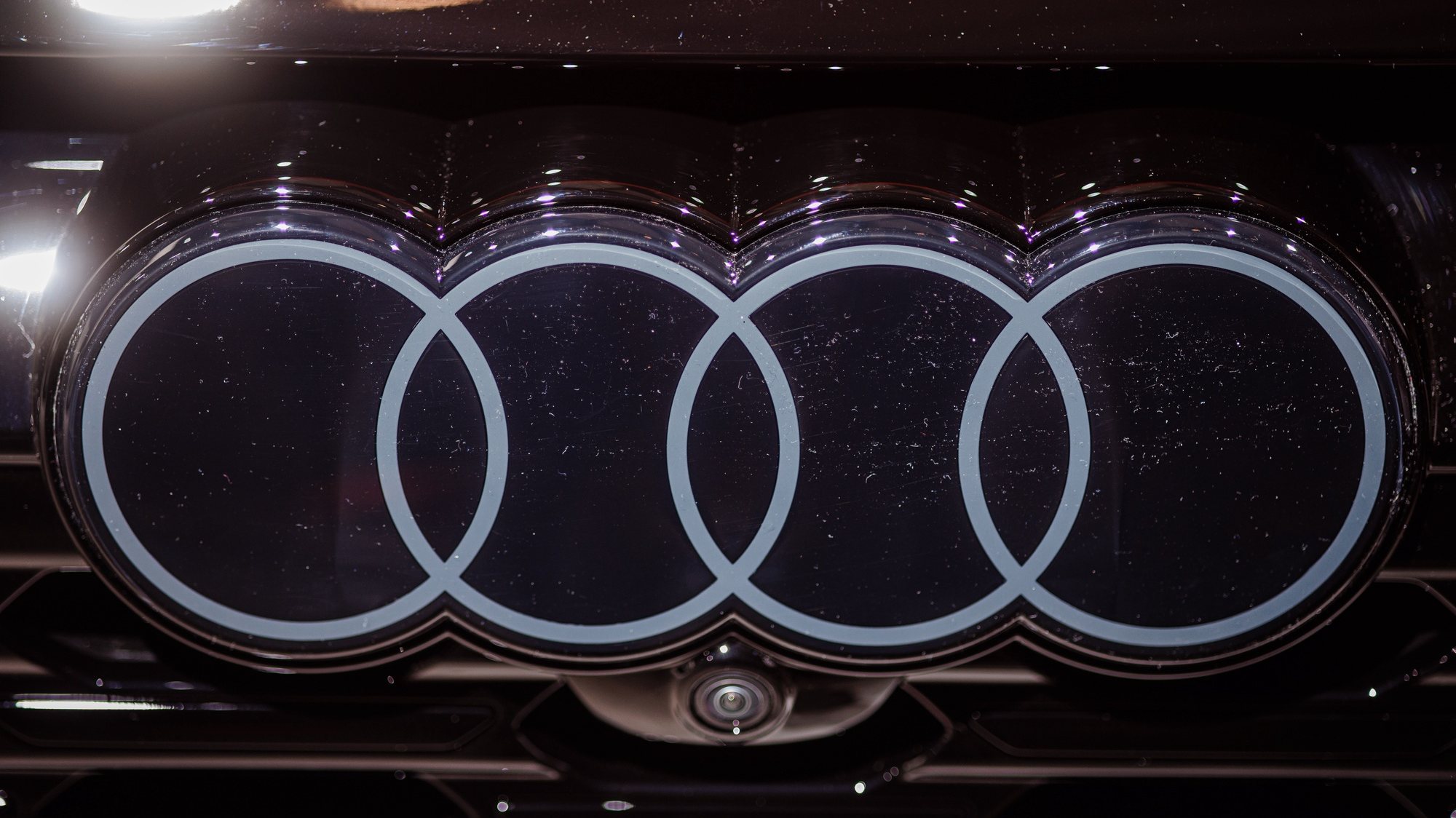 epa10619095 The Audi badge on the front of a car at the Annual General Meeting of Volkswagen in Berlin, Germany, 10 May 2023. The 63rd Annual General Meeting 2023 of Volkswagen auto-mobility company takes place on 10 May 2023 at CityCube conference center in Berlin.  EPA/CLEMENS BILAN