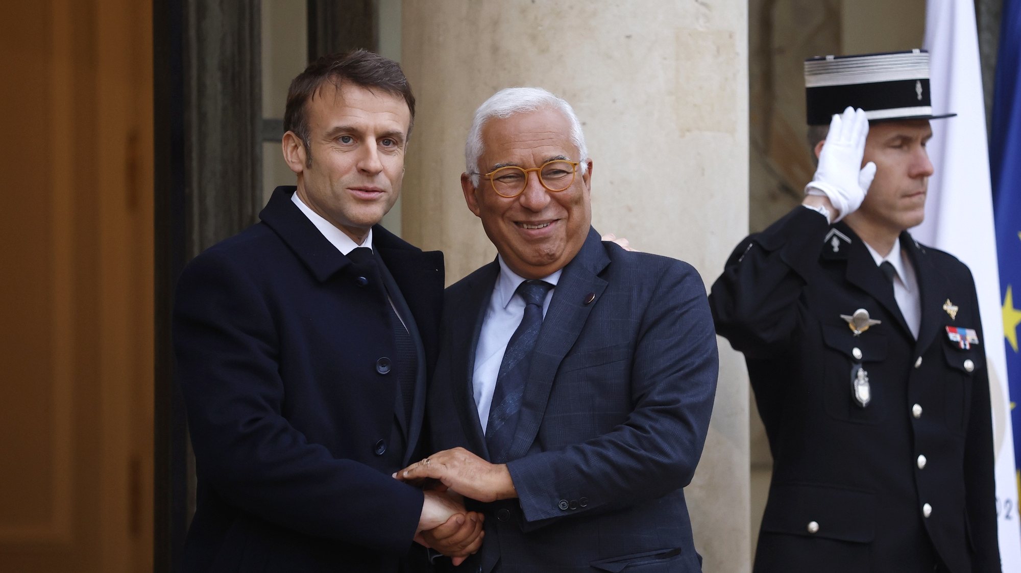 epa11183241 French President Emmanuel Macron (L) greets Portugal&#039;s Prime Minister Antonio Costa (C) upon his arrival at the Elysee Palace to attend the international conference in support of Ukraine in Paris, France, 26 February 2024.  EPA/YOAN VALAT