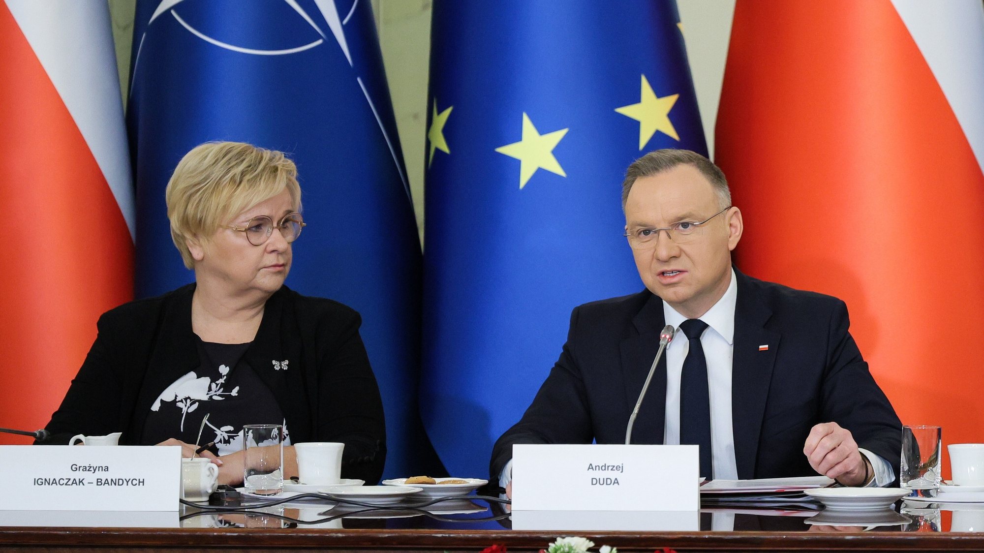 epa11214275 Polish President Andrzej Duda (R) and head of the Polish President Chancellery Grazyna Ignaczak-Bandych (L) attend a meeting of the National Security Council (BBN) at the Presidential Palace in Warsaw, Poland, 11 March 2024. The meeting was held before the departure of Polish President Andrzej Duda and Prime Minister Donald Tusk on their visit to Washington on 12 March, where they will meet the US president on the 25th anniversary of Poland&#039;s accession to NATO.  EPA/PAWEL SUPERNAK POLAND OUT