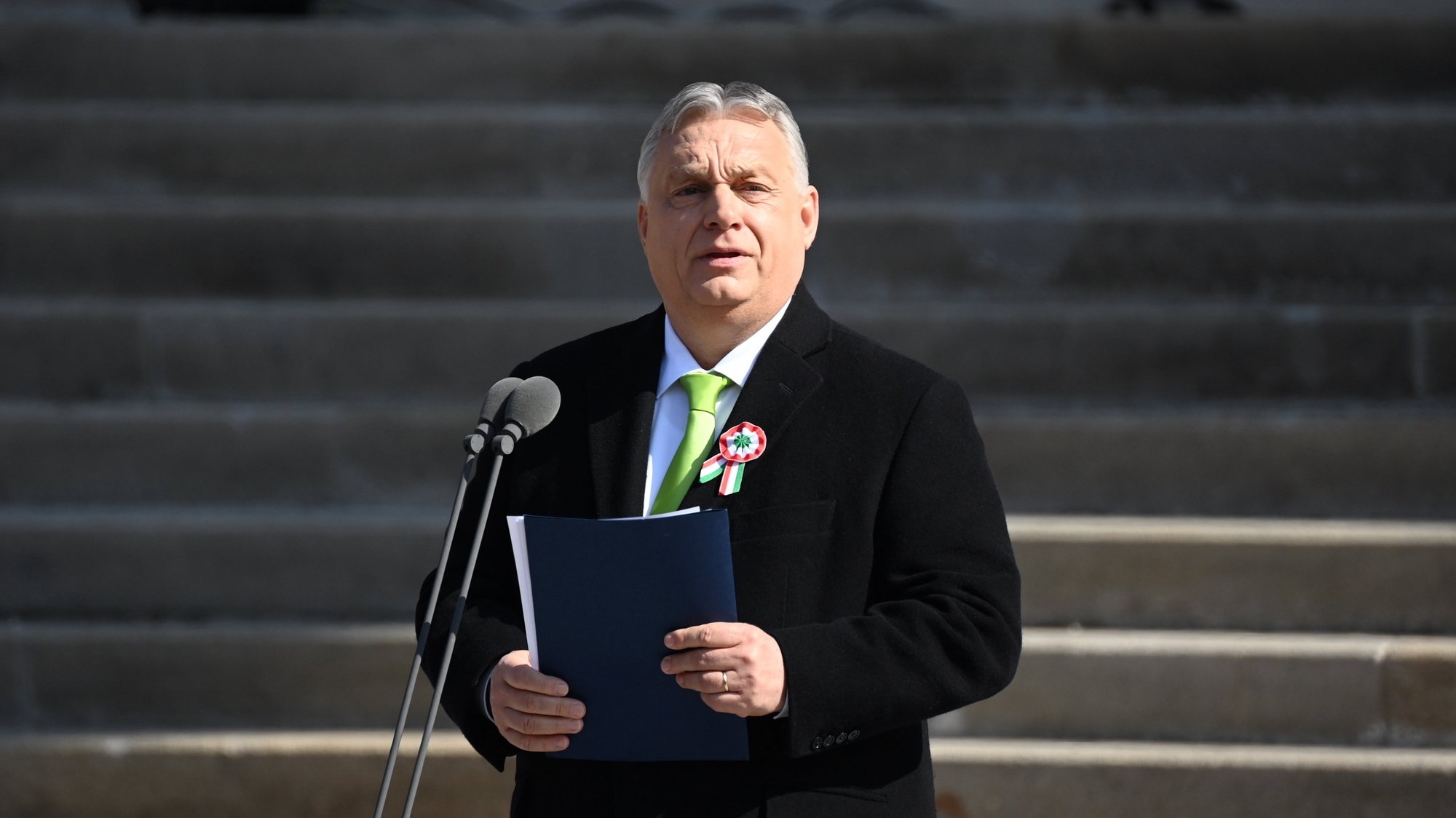 epa11221943 Hungarian Prime Minister Viktor Orban delivers his speech on the steps of the Hungarian National Museum during the official state ceremony to mark the 176th anniversary of the outbreak of the 1848 revolution and war of independence against Habsburg rule in Budapest, Hungary, 15 March 2024.  EPA/ZOLTAN MATHE HUNGARY OUT