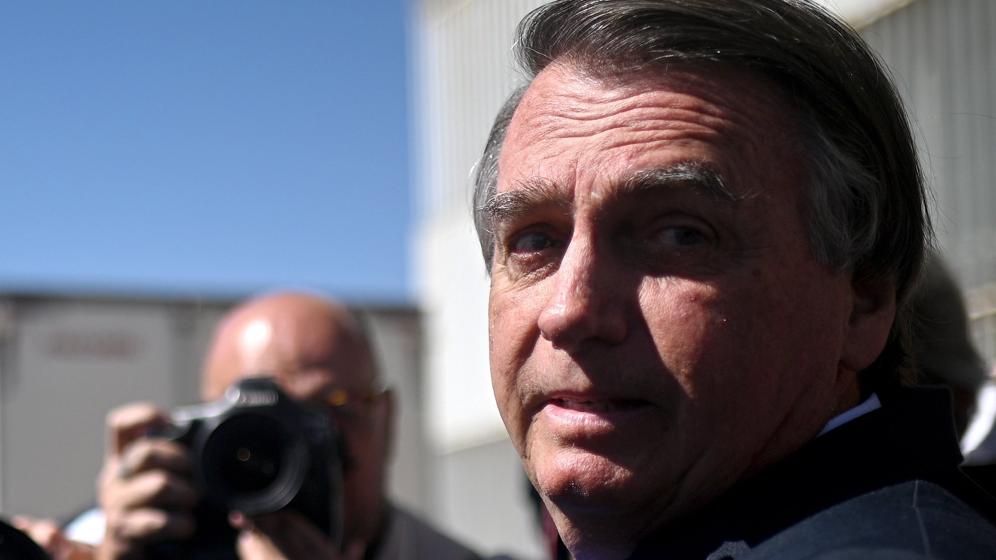 epa10704195 Former president of Brazil, Jair Bolsonaro, leaves the Federal Senate after visiting his son Senator Flavio Bolsonaro at the National Congress in Brasilia, Brazil 21 June 2023. The Superior Electoral Court (TSE) will begin a trial on 22 June for alleged abuses of power by former Brazilian President Jair Bolsonaro, who may lose all his political rights if found guilty.  EPA/Andre Borges