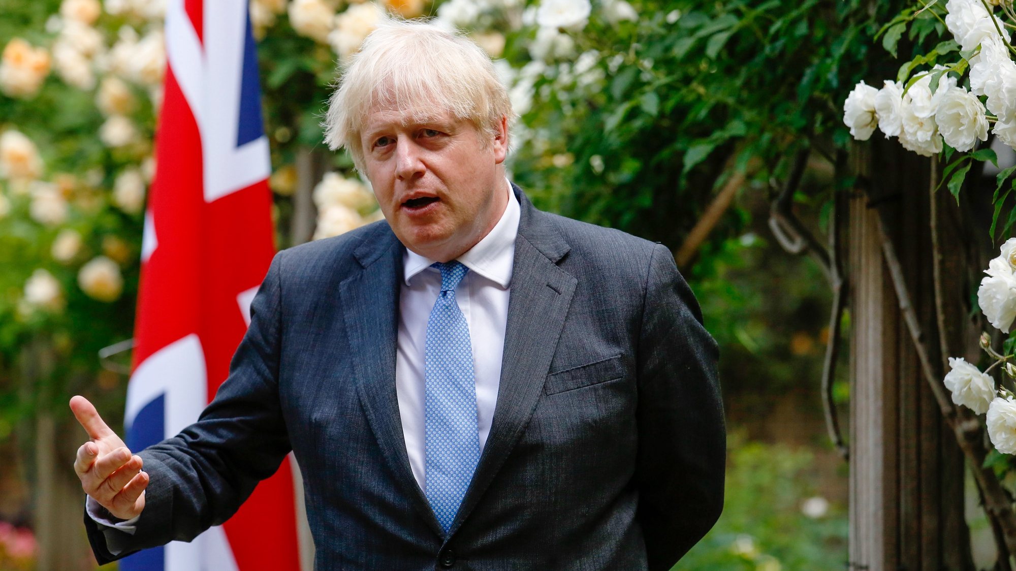 epa09272673 British Prime Minister Boris Johnson, gestures during a joint news conference with Australian counterpart Scott Morrison, during their bilateral meeting in the garden of number 10 Downing Street in London, Britain, 15 June 2021. The U.K. is set to announce the broad terms of a free-trade deal with Australia on 15 June, its latest post-Brexit accord as Prime Minister Boris Johnson seeks to expand commerce beyond the European Union.  EPA/Luke MacGregor / POOL