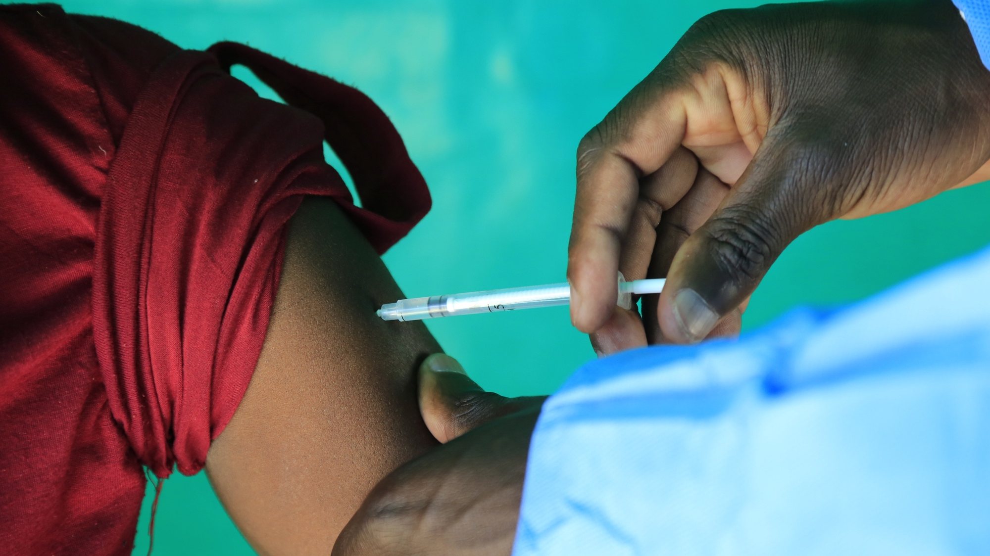 epa09401338 A person receives a covid-19 vaccine at Chitungwiza General Hospital, Chitungwiza, Zimbabwe, 06 August 2021. The vaccination campaign is continuing as the Covid-19 cases are rising.  EPA/AARON UFUMELI