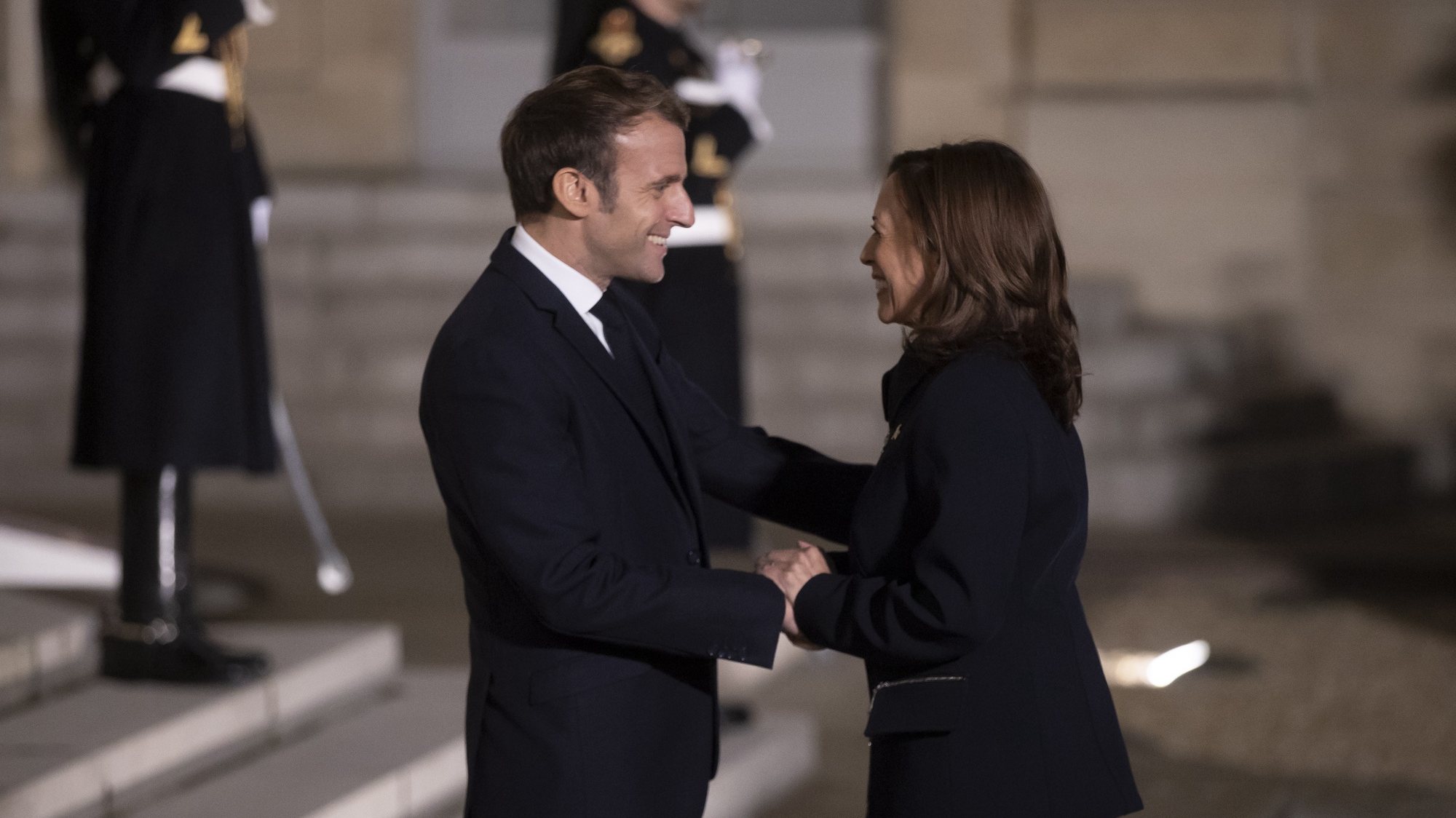 epa09574447 French President Emmanuel Macron (L) greets US Vice President Kamala Harris (R)  as she arrives for a meeting at the Elysee Palace in Paris, France,10 November 2021. Harris is on her first trip to Europe as Vice President.  EPA/IAN LANGSDON