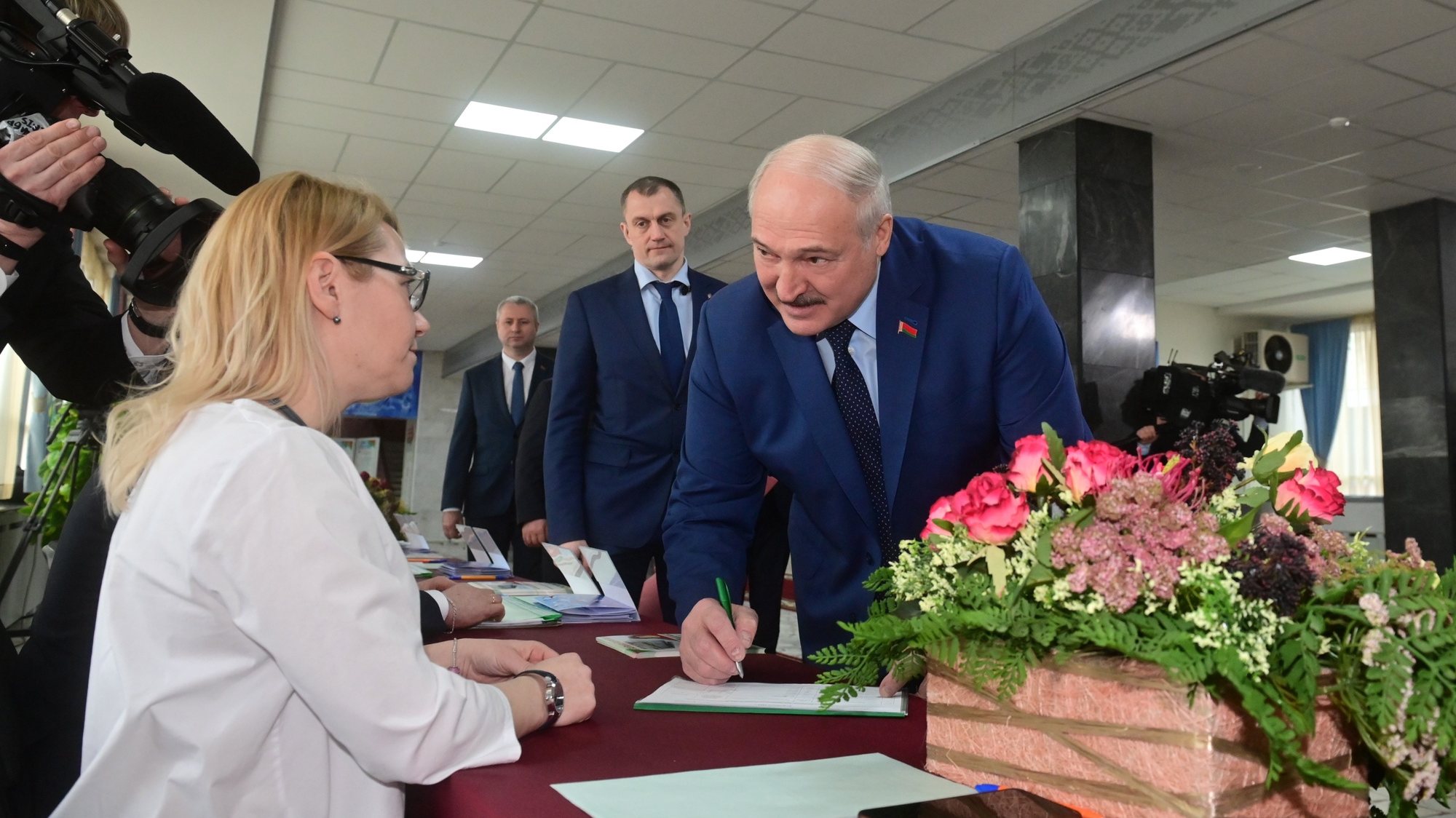 epa09789234 A handout picture made available by Belarus President Press-service shows Belarusian President Aleksandr Lukashenko (R) votes during referendum on constitutional amendments in Minsk, Belarus, 27 February 2022. A total of 5,510 polling stations are open across the country for over 6.8 million registered voters.The Belarusian Central Elections Commission (CEC) has said that it has found the referendum on constitutional amendments to be successful.  EPA/BELARUS PRESIDENT PRESS-SERVICE /HANDOUT HANDOUT HANDOUT EDITORIAL USE ONLY/NO SALES HANDOUT EDITORIAL USE ONLY/NO SALES