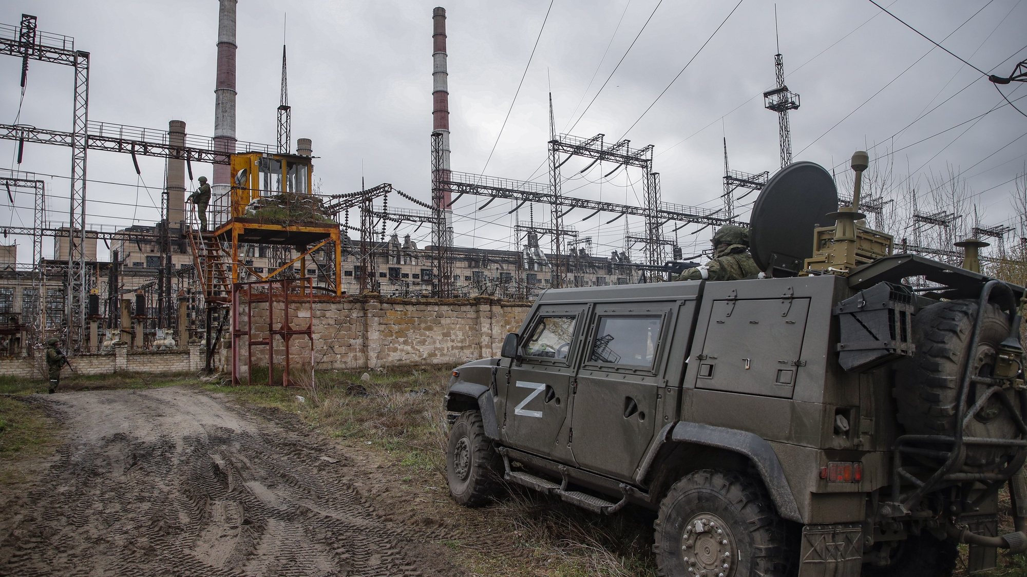 epa09888318 A picture taken during a visit to Luhansk organized by the Russian military shows Russian servicemen guard on the entrance of the Luhansk Power Station in Shchastia, Luhansk region, Ukraine, 13 April 2022. Stopped by the Ukrainian side a few days before the start of the Russian special operation, the station provided electricity to more than a million people. The Ukrainian Armed Forces mined the object during the retreat, and some high-voltage power lines were damaged during the fighting. The station is a strategic and important energy facility of the self-proclaimed Luhansk People&#039;s Republic. After the start of operation of the station, it will be possible to start production at the metallurgical enterprises of the republic, which was stopped in 2014, when the station was cut off from the energy system of Lugansk. On 24 February Russian troops had entered Ukrainian territory in what the Russian president declared a &#039;special military operation&#039;, resulting in fighting and destruction in the country, a huge flow of refugees, and multiple sanctions against Russia.  EPA/SERGEI ILNITSKY