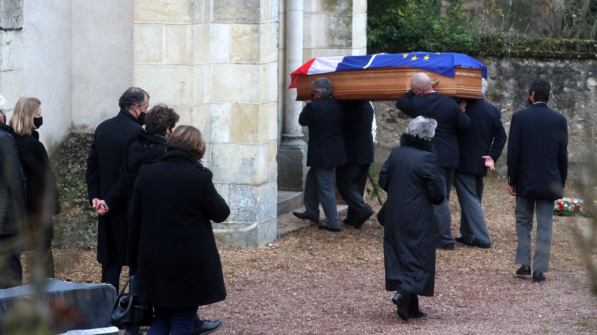 epa08863210 Anne-Aymone Giscard d&#039;Estaing, wife of the late former French President Valery Giscard d&#039;Estaing, and relatives follow the European and French flag-draped coffin containing Giscard d&#039;Estaing&#039;s remains at the Saint Hilaire church in Authon, France, 05 December 2020. Giscard died of complications after contracting COVID 19 disease, at the age of 94. The former French president Valery Giscard D&#039;Estaing was head of state from 1974 to 1981.  EPA/CHRISTOPHE PETIT TESSON