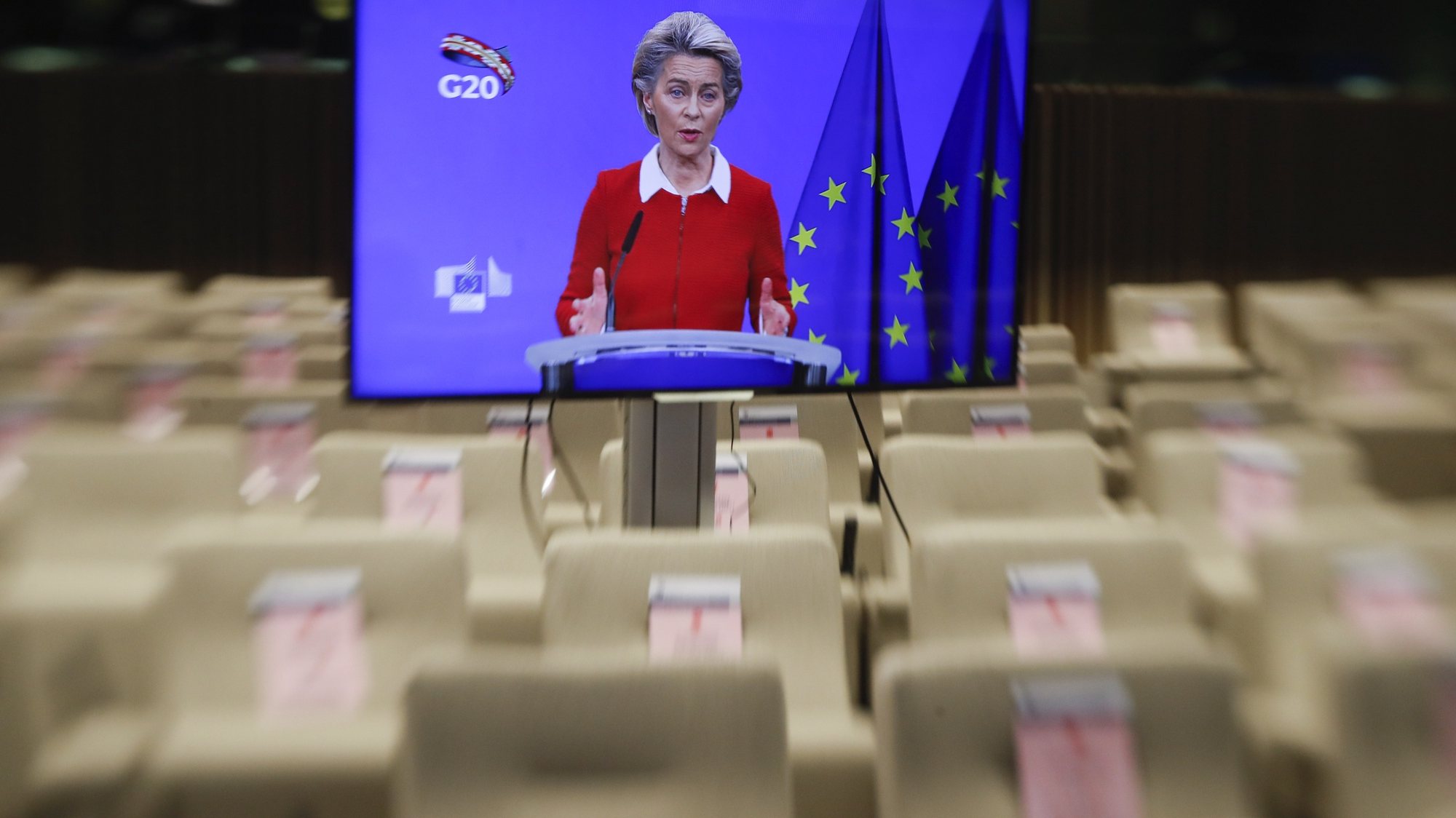epa08830651 A tiltshift lens image of European Commission President Ursula Von Der Leyen seen on a screen as she along with European Council President Charles Michel (unseen) give a joint press briefing ahead of a G20 online meeting, in Brussels, Belgium, 20 November 2020. The G20 Leaders’ Summit will be held virtually on 21 and 22 November and is organized by Saudi Arabia&#039;s current G20 Presidency.  EPA/OLIVIER HOSLET / POOL