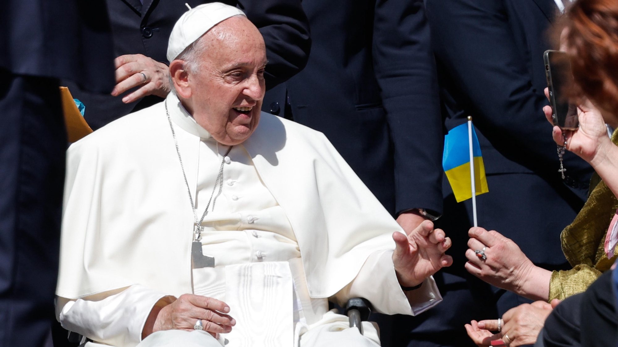 epa11390639 A faithful hands Pope Francis a Ukrainian flag during his weekly general audience in Saint Peter&#039;s Square, Vatican City, 05 June 2024.  EPA/GIUSEPPE LAMI