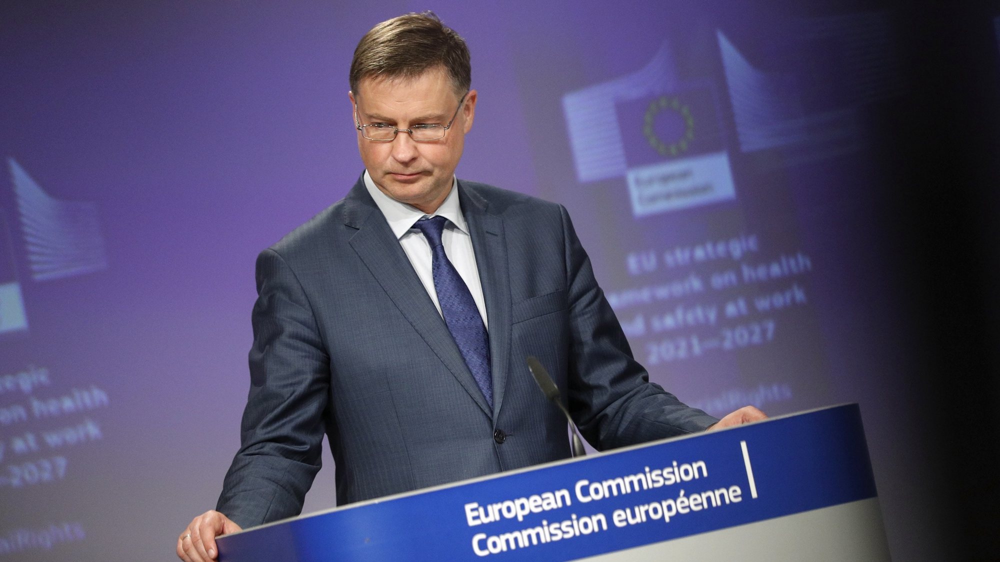 epa09307632 European Commission vice-president Valdis Dombrovskis gives a news conference with Commissioner Nicolas Schmit on communication on a new occupational safety and health strategy framework in Brussels, Belgium, 28 June 2021.  EPA/JOHANNA GERON / POOL