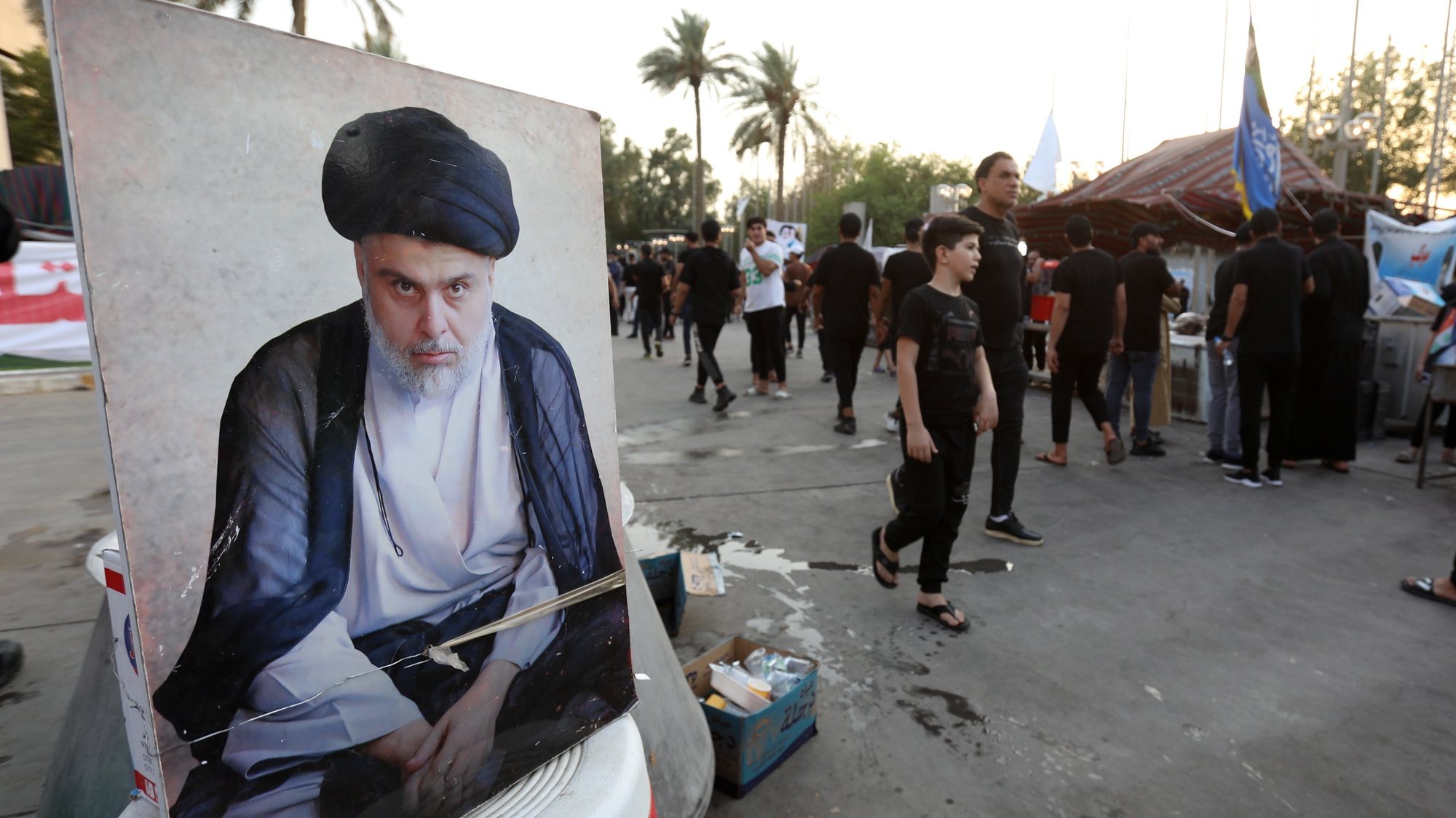 epa10114940 Supporters of Iraqi Shiite cleric Muqtada al-Sadr, head of the Sadrist movement walk next to the Iraqi parliament building, Baghdad, Iraq, 10 August 2022. Sadrist Movement leader Muqtada al-Sadr called on the Iraqi judiciary to dissolve the parliament by the &#039;end of next week&#039; and task the president with setting early parliament elections. Thousends of the al-Sadr followers stormed the Iraqi parliament building in the heavily fortified Green Zone, home to government buildings and foreign embassies in Baghdad on 31 July 2022.  EPA/AHMED JALIL