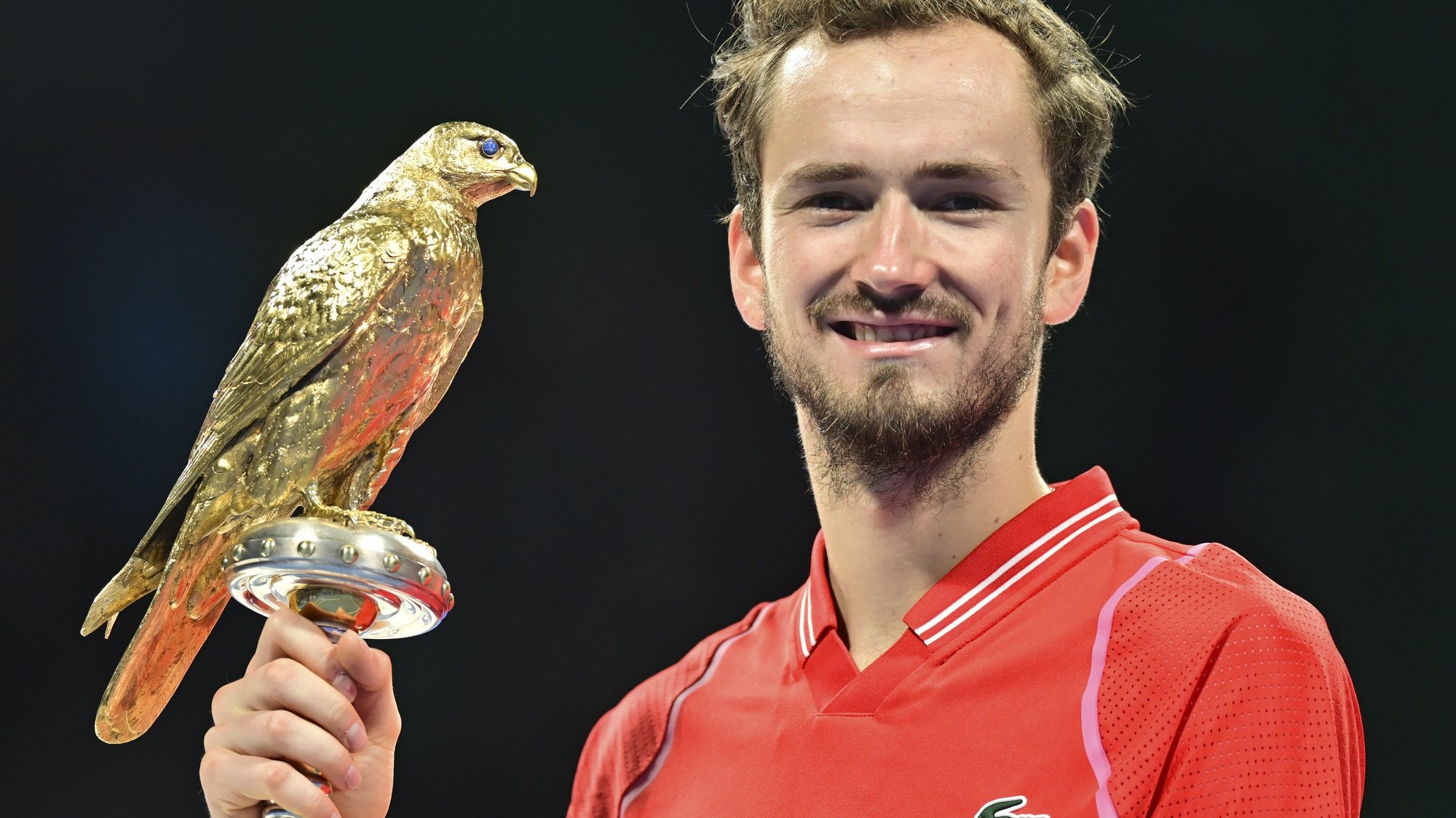 epa10491072 Daniil Medvedev of Russia poses with his trophy after winning the ATP Qatar Open tennis tournament final against Andy Murray of Great Britainat the Khalifa International Tennis Complex in Doha, Qatar, 25 February 2023.  EPA/NOUSHAD THEKKAYIL