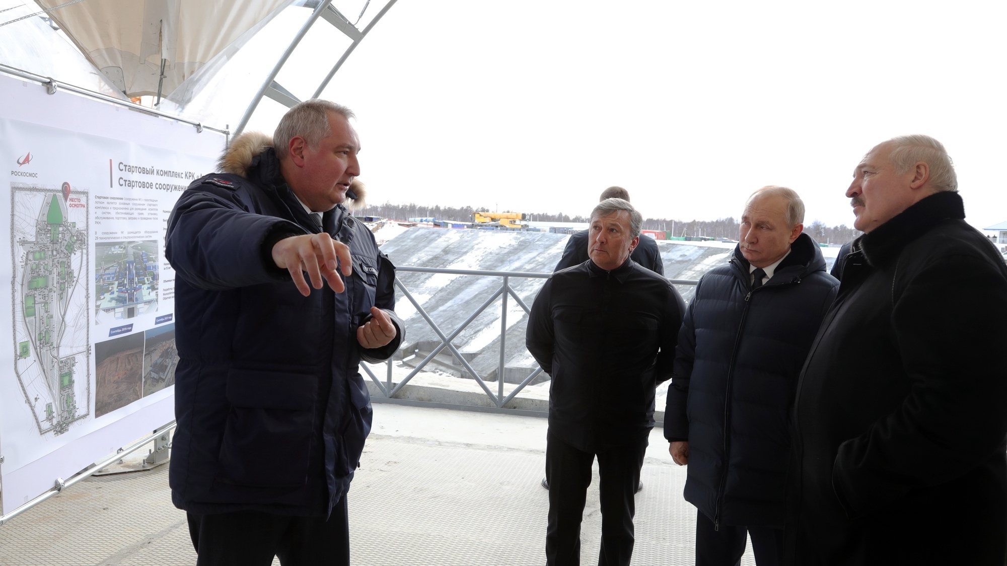 epa09885669 Russian President Vladimir Putin (2-R), Belarusian President Alexander Lukashenko (R) and Roscosmos State Space Corporation Director General Dmitry Rogozin (L) visit a construction site of the Angara space rocket complex at the Vostochny cosmodrome outside the city of Tsiolkovsky, some 180 km north of Blagoveschensk, in the far eastern Amur region, Russia, 12 April 2022. Belarusian President is on a working visit to Russia.  EPA/MIKHAIL KLIMENTYEV / KREMLIN POOL / SPUTNIK MANDATORY CREDIT