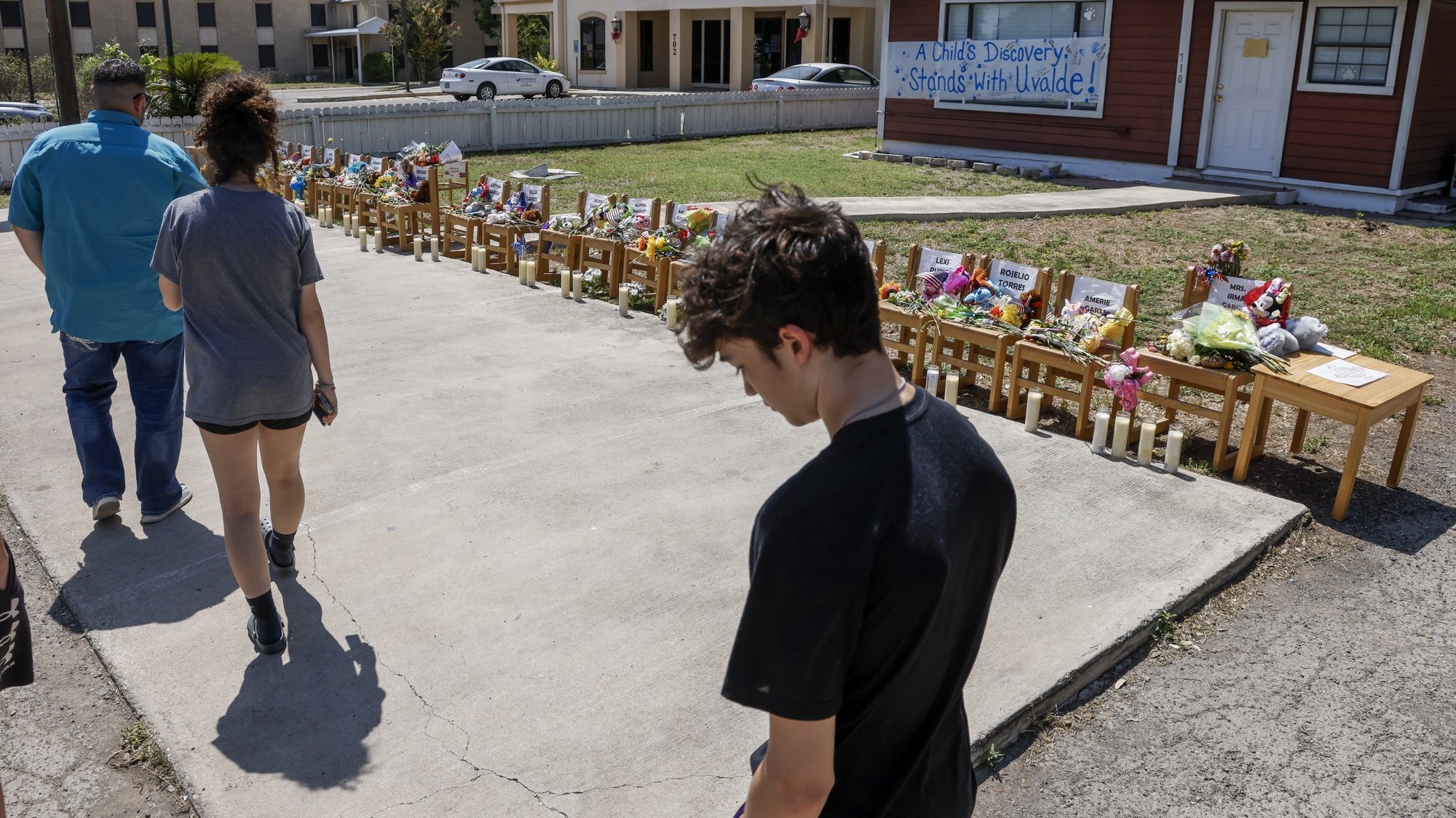 epa09985680 People continue to pay respect to the victims at a Uvalde day care center where chairs represent each victim as a memorial following the shooting at Robb Elementary School in Uvalde, Texas, USA, 29 May 2022. According to Texas officials, at least 19 children and two adults were killed in the shooting on 24 May. The eighteen-year-old gunman was killed by responding officers.  EPA/TANNEN MAURY
