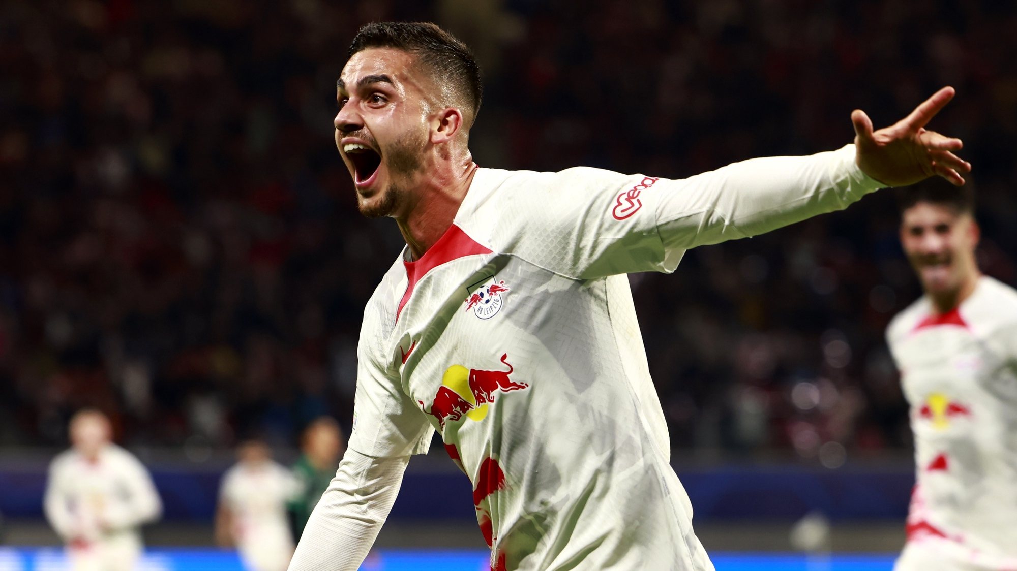 epa10225463 Andre Silva of Leipzig celebrates his scoring during the UEFA Champions League group F soccer match between RB Leipzig and Celtic Glasgow in Leipzig, Germany, 05 October 2022.  EPA/Hannibal Hanschke