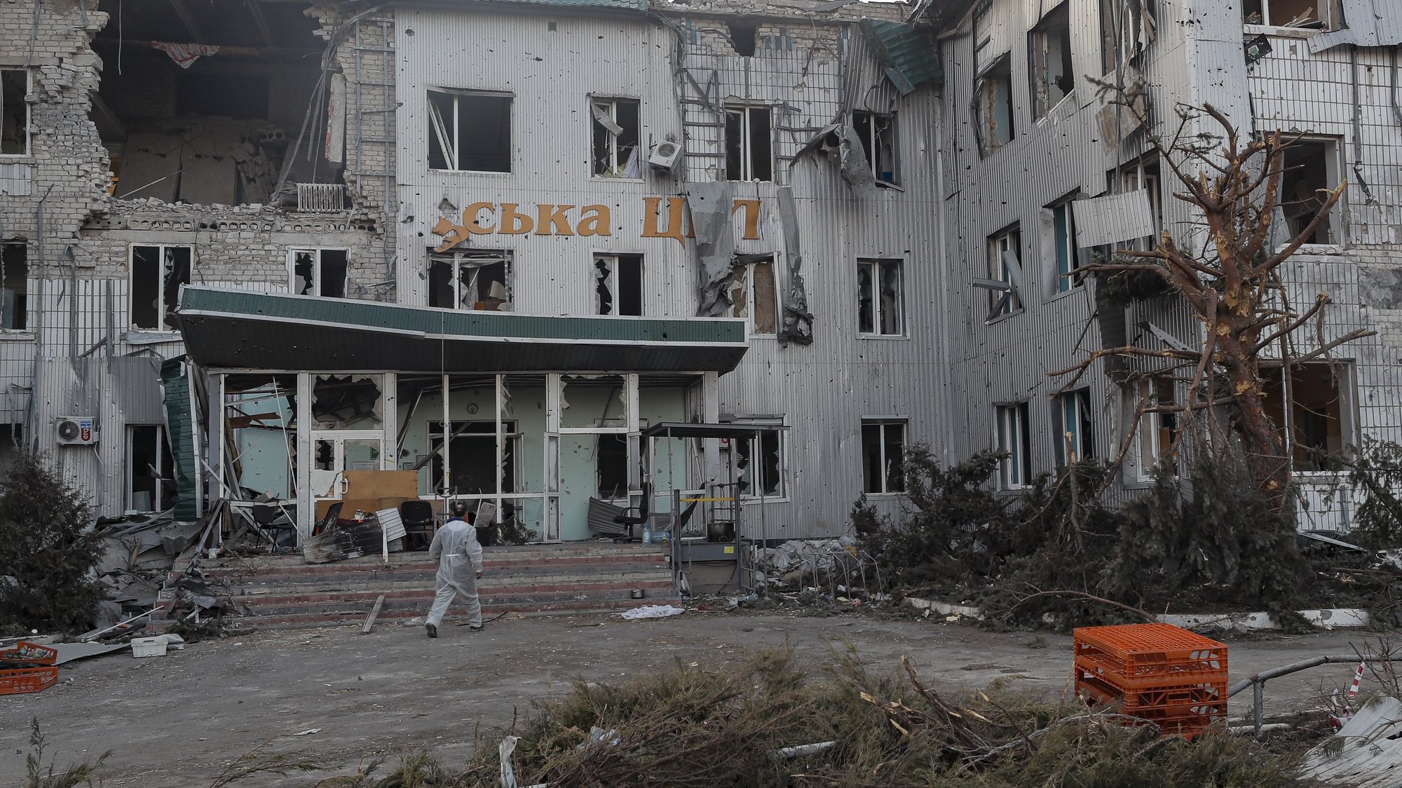 epaselect epa09851755 A man walks near the destroyed local hospital building in downtown Volnovakha, Ukraine, 26 March 2022. Troops of the self-proclaimed Donetsk People&#039;s Republic with Russian support entered Volnovakha, a small town near Donetsk. Donetsk People&#039;s Republic official said that the housing stock of the city of Volnovakha was destroyed by 85 percent, the city would have to be rebuilt. On 24 February Russian troops had entered Ukrainian territory in what the Russian president declared a &#039;special military operation&#039;, resulting in fighting and destruction in the country, a huge flow of refugees, and multiple sanctions against Russia.  EPA/SERGEI ILNITSKY
