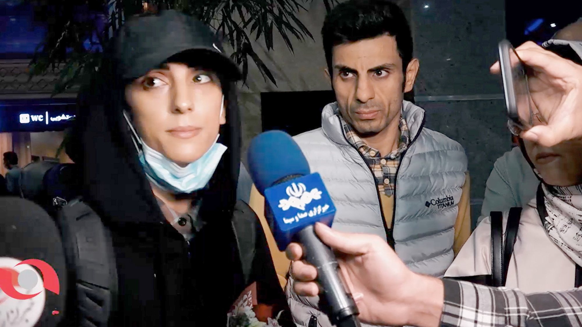 epa10251948 A grab from a handout video made available by Borna News Agency for Iranian competitive climber Elnaz Rekabi speaking to journalists upon her arrival at the Imam Khomeini International Airport in Tehran, Iran, 19 October 2022. Rekabi returned to Tehran after competing in South Korea without wearing a mandatory headscarf required for Iranian female athletes from the Islamic Republic. Rekabi has described her not wearing a hijab as unintentional act as she was in rush to prepare for competition, and apologized for that.  EPA/BORNA NEWS AGENCY HANDOUT  HANDOUT EDITORIAL USE ONLY/NO SALES