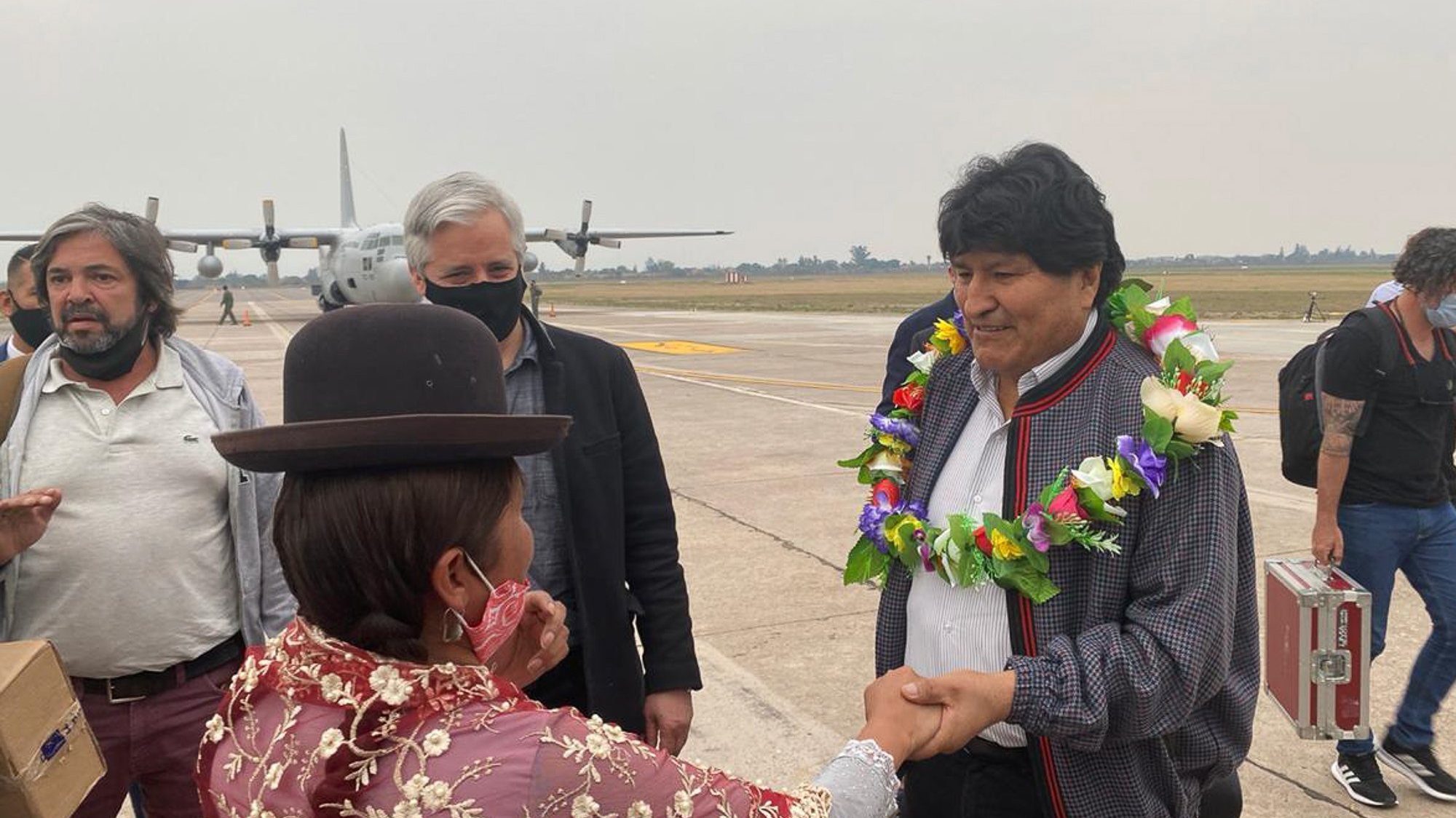epa08808994 A handout photo made available by Evo Morales press office shows former President of Bolivia, Evo Morales (R), as he greets an indigenous woman upon arrival in the Province of Jujuy, Argentina, 08 November 2020. Morales plans to return to his country after a year of exile, stating that he was forced by a coup. He is expected to be received by a caravan as soon as he enters Bolivia from the border with Argentina, where he has remained since his departure from his home country.  EPA/EVO MORALES PRESS OFFICE / HANDOUT  HANDOUT EDITORIAL USE ONLY/NO SALES