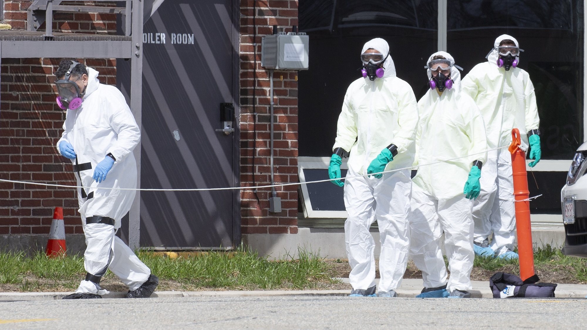 epa08697437 (FILE) - A disinfecting crew in hazmat suits enters the Soldiers&#039; Home in Holyoke, Massachusetts, USA 31 March 2020 (reissued 25 September 2020). According to a statement by Massachusetts attorney general Maura Healey on 25 September 2020, Holyoke Soldiers&#039; Home Superintendent Bennett Walsh and former Medical Director Dr. David Clinton have been charged with five counts each of caretaker who wantonly or recklessly commits or permits bodily injury to an elder or disabled person and caretaker who wantonly or recklessly commits or permits abuse, neglect, or mistreatment to an elder or disabled person. At least 76 residents died at the home due to Covid-19 infections.  EPA/CJ GUNTHER *** Local Caption *** 56173358