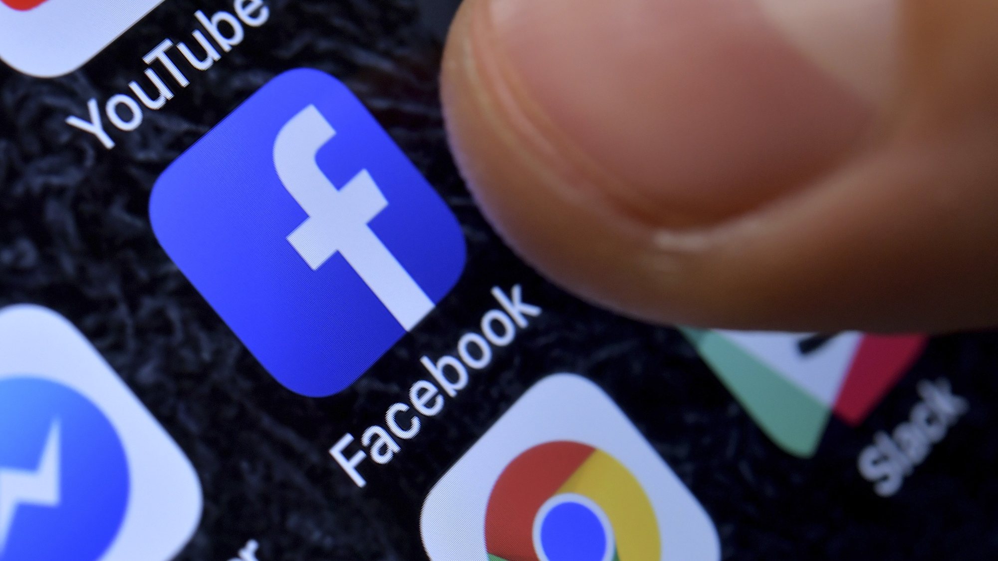epa08445018 (FILE) - A close-up image showing the Facebook app on an iPhone in Kaarst, Germany, 08 November 2017 (reissued 25 May 2020). German federal court, BGH, is due to announce its long awaited decision 29 May 2020 in data protection lawsuit in a consumer centres vs Facebook case.  EPA/SASCHA STEINBACH *** Local Caption *** 55831121