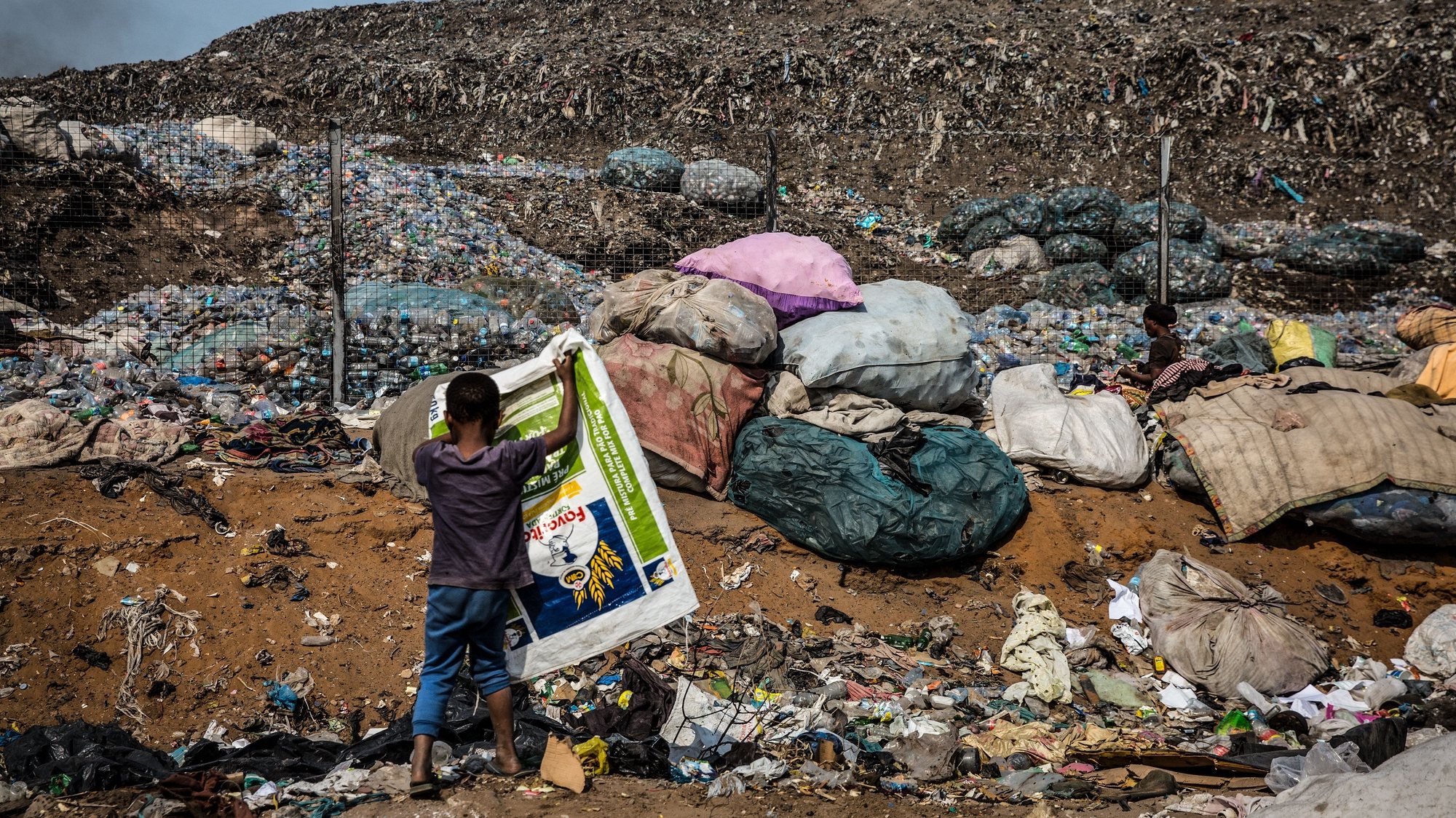 A child at the Hulene dump in Maputo, Mozambique, 20 August 2020 (issued 26 September 2020). The collection of plastic in Maputo is a business dominated mostly by young people and women and has been the income base for many families, especially those living on the outskirts of the dump. RICARDO FRANCO/LUSA