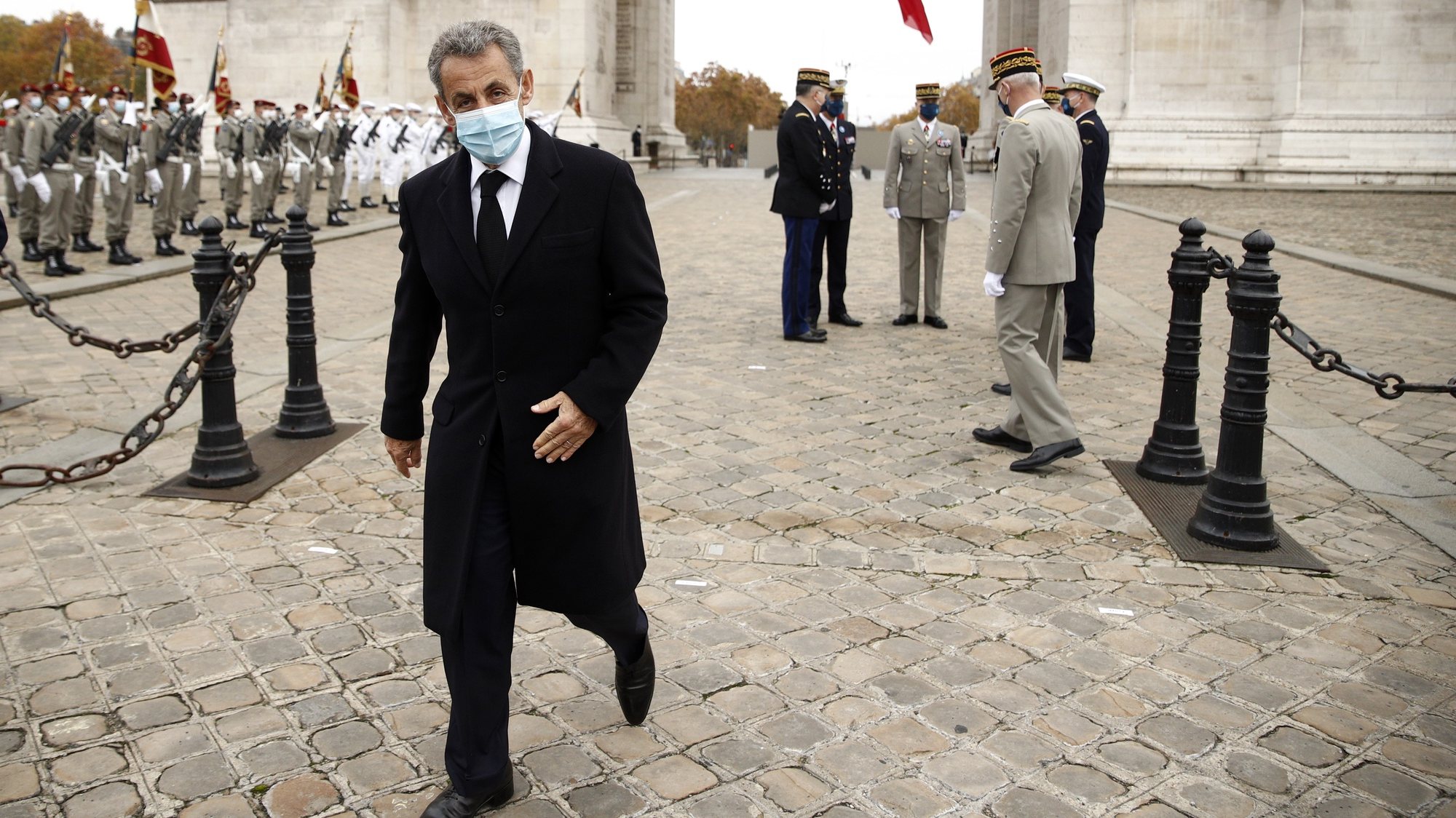 epa08812986 French former President Nicolas Sarkozy leaves after attending a ceremony at the Arc de Triomphe in Paris, France, 11 November 2020, as part of the commemorations marking the 102nd anniversary of the 11 November 1918 armistice, ending World War I (WWI).  EPA/YOAN VALAT / POOL