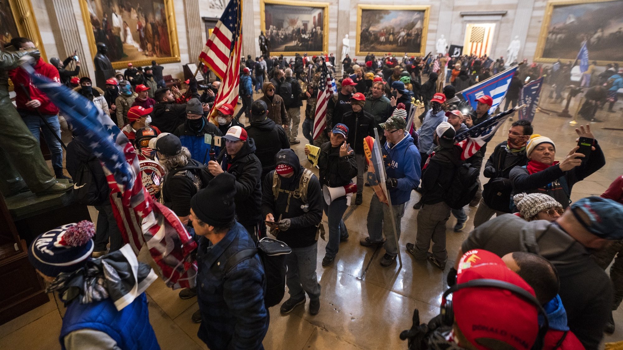 epaselect epa08923423 Supporters of US President Donald J. Trump in the Capitol Rotunda after breaching Capitol security in Washington, DC, USA, 06 January 2021. Protesters entered the US Capitol where the Electoral College vote certification for President-elect Joe Biden took place.  EPA/JIM LO SCALZO