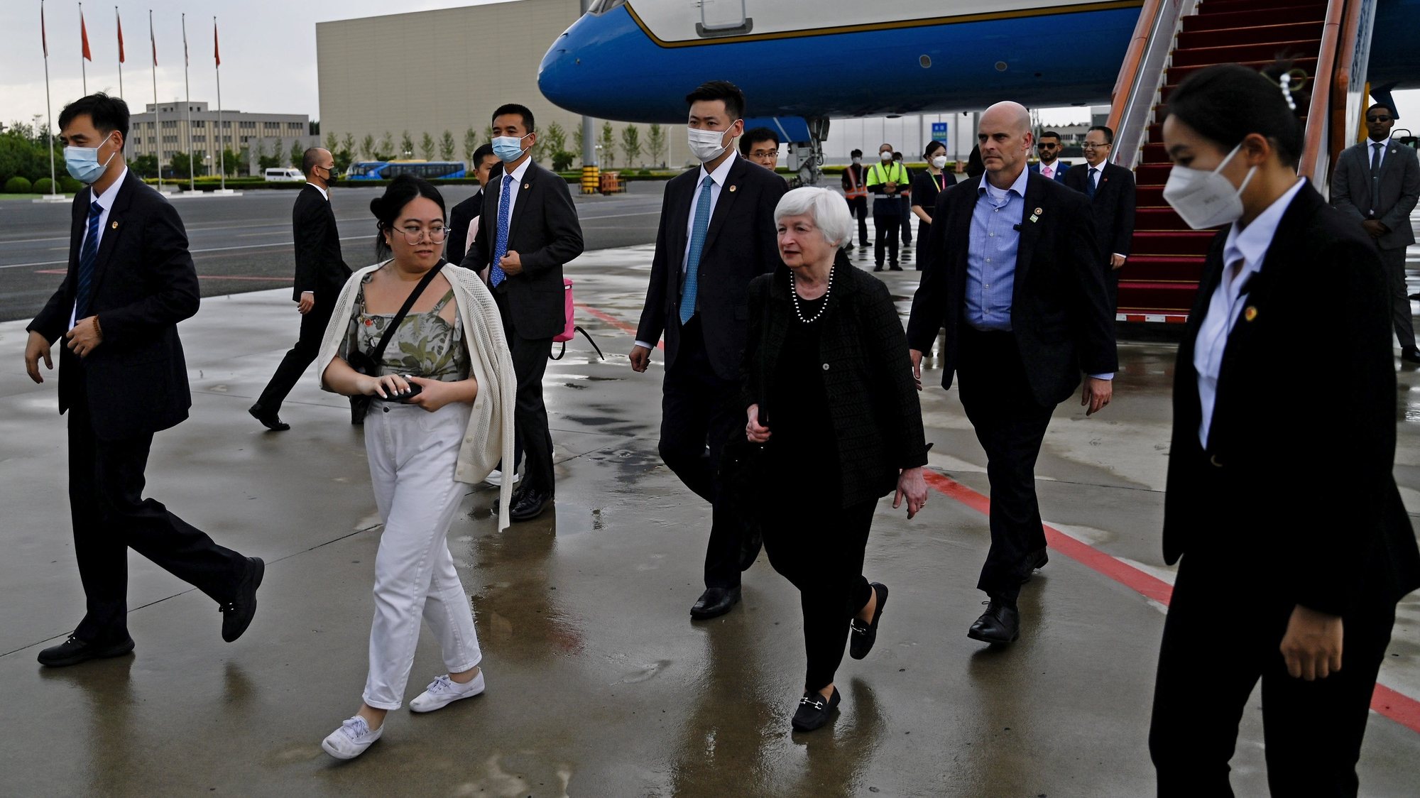 epa10729194 U.S. Treasury Secretary Janet Yellen (C) is accompanied by officials and security personnel as she arrives at Beijing Capital International Airport in Beijing, China, 06 July 2023. Secretary of the Treasury Janet L. Yellen travels to Beijing from 06 to 09 July for meetings with senior Chinese officials, the U.S. Treasury announced.  EPA/Pedro PARDO / POOL