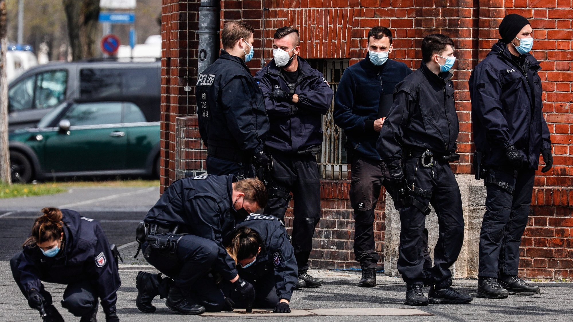 epa09167583 Police investigate in front of Oberlin care Clinic in Potsdam, Germany, 29 April 2021. German police arrested a woman on suspicion of killing four people on late evening of 28 April.  EPA/FILIP SINGER