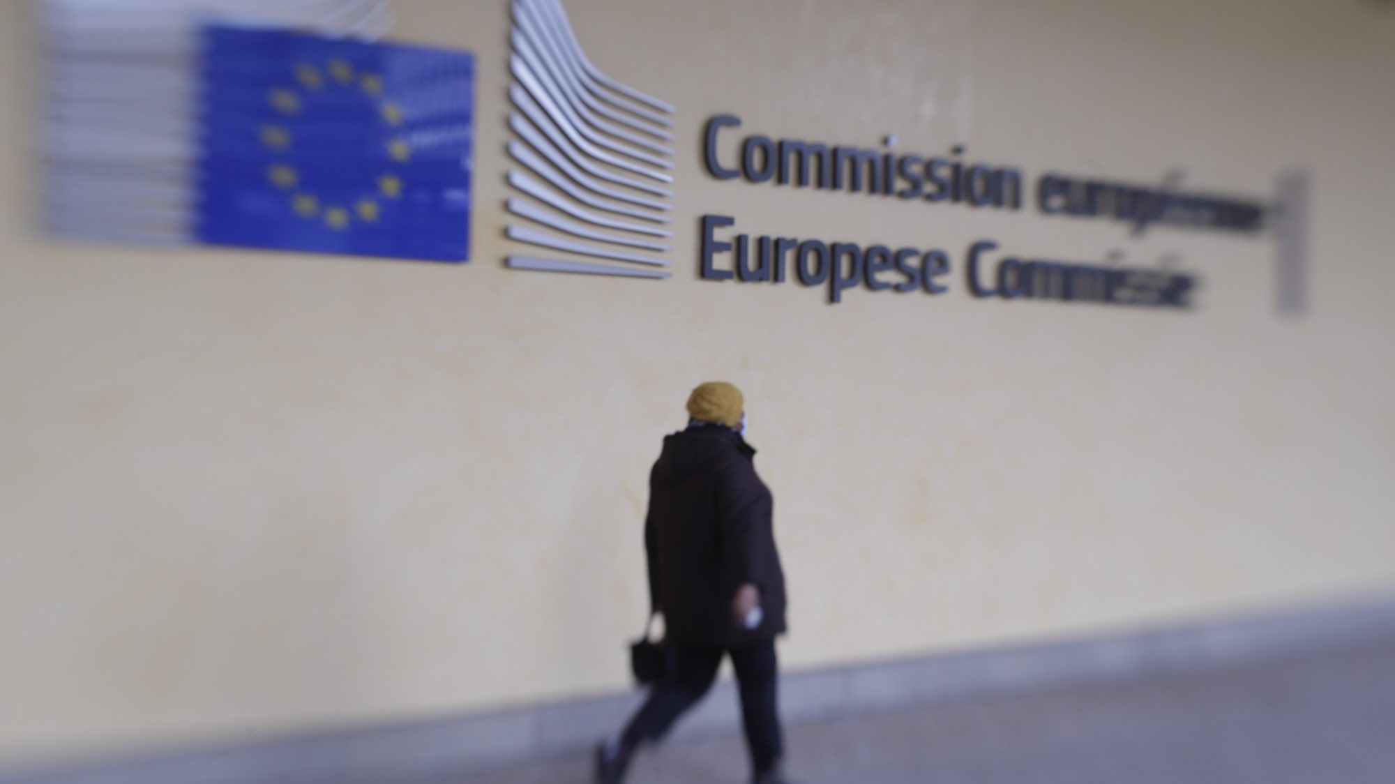epa08795886 A picture taken with Lensbaby shows a person walking in front of European Commission headquarters in Brussels, Belgium, 03 November 2020.  EPA/OLIVIER HOSLET Taken with Lensbaby
