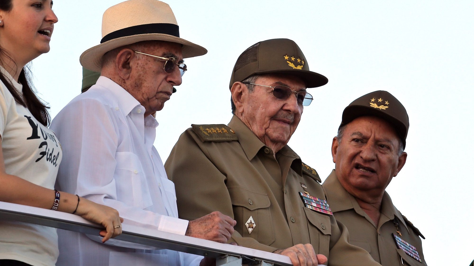 epa05695209 Cuban President Raul Castro (2-R), with Comunist Party under secretary Jose Ramon Machado (2-L), Revolutionary Army Forces minister Leopoldo Cintra Frias (R) and President of the Universitary Students Federation Jennifer Bella (L) attend the military parade on the occasion of the 58th anniversary of the Cuban Revolution, at the Revolution Square, in Havana, Cuba, 02 January 2017. The military parade and march of the &#039;combative people&#039; is dedicated to former Cuban leader Fidel Castro, who died last November 2016.  EPA/ALEJANDRO ERNESTO