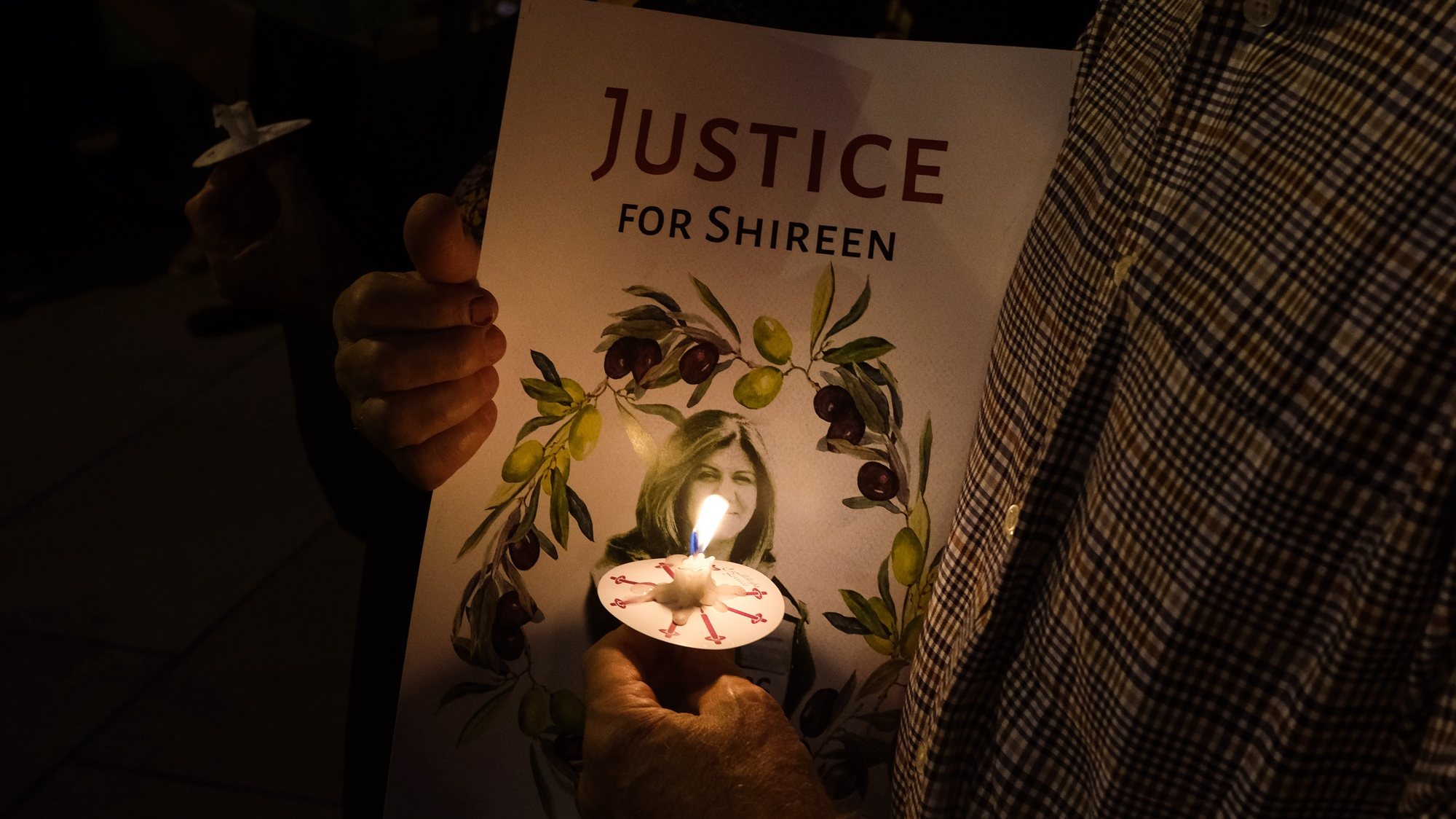 epa09954218 People attend a candlelight vigil to honor the slain al-Jazeera Journalist Shireen Abu Akleh, in Washington, DC, USA, 17 May 2022. Al Jazeera journalist Shireen Abu Akleh was killed on 11 May 2022 during a raid by Israeli forces in the West Bank town of Jenin.  EPA/GAMAL DIAB