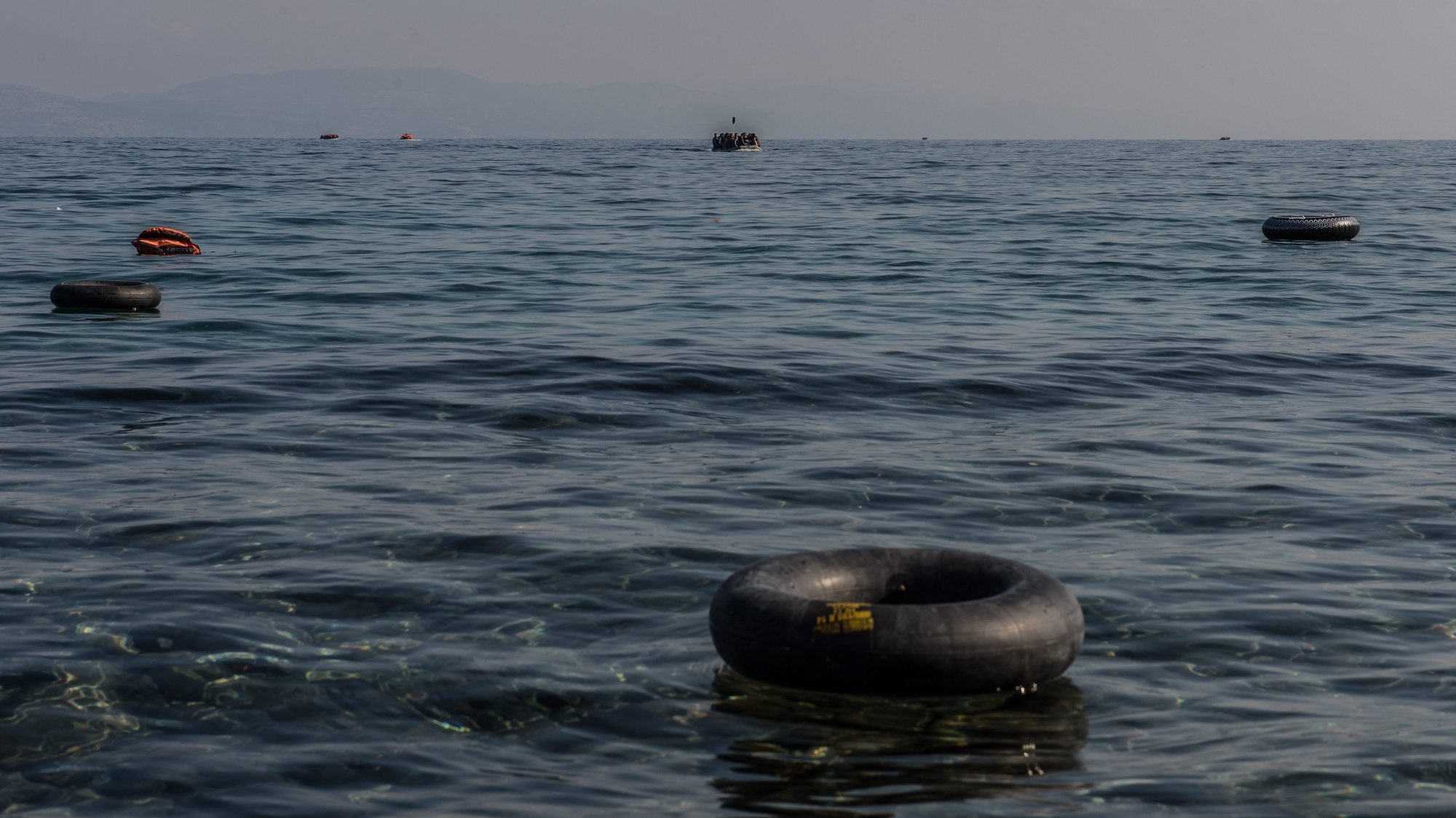 epa04964351 Sea full of rubber rings for migrants on the sea near Skala Sikaminias, Lesbos island, Greece, 05 October 2015. An estimated 100,000 refugees and migrants arrived on the Greek islands during August, according to the Hellenic Coast Guard  EPA/FILIP SINGER