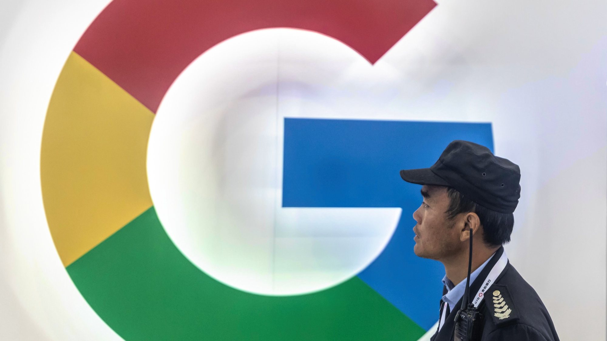 epa08257756 (FILE) - A security guard passes a Google booth during Big Data Expo in Guiyang, Guizhou province, China, 26 May 2019 (reissued 29 February 2020). Google has expanded travel restritcion on employees after a person tested positive for coronavirus at the company&#039;s Zurich. According to media reports, by March employees will see restrctions on traveling to Japan, South Korea, China, Iran and parts of Italy.  EPA/ALEKSANDAR PLAVEVSKI