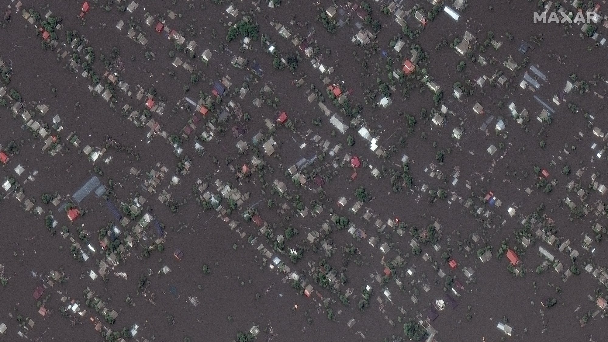 epa10679591 A handout satellite image made available by Maxar Technologies shows the flooded town of Oleshky following the collapse of the Nova Kakhovka Dam the previous day, Ukraine, 07 June 2023 (issued 08 June 2023).  EPA/MAXAR TECHNOLOGIES HANDOUT -- MANDATORY CREDIT: SATELLITE IMAGE 2023 MAXAR TECHNOLOGIES -- THE WATERMARK MAY NOT BE REMOVED/CROPPED -- HANDOUT EDITORIAL USE ONLY/NO SALES