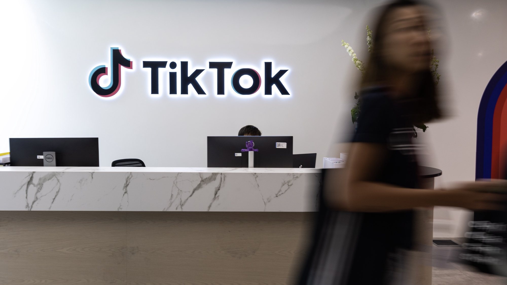 epa10826357 A staff member walks past the reception counter in the TikTok office during a press tour of Bytedance and TikTok’s offices in Singapore, 29 August 2023. ByteDance Ltd. is the parent company of popular short-video platform TikTok, which has headquarters in Singapore and Los Angeles.  EPA/HOW HWEE YOUNG