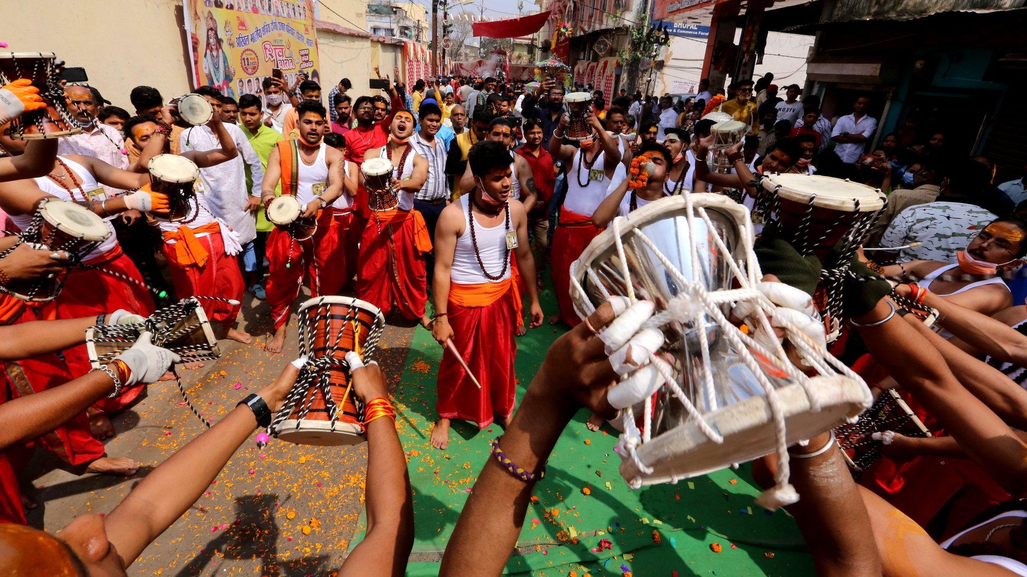 epa09067041 Devotees play musical instruments during the Shiv Barat or Shiv wedding procession as part of the Maha Shivratri festival in Bhopal, India, 11 March 2021. Maha Shivaratri is celebrated by Hindus in honor of Lord Shiva with ritual bathing of Shivalingams and prayers. Unmarried women observe fast from dawn to dusk and pray to Lord Shiva to give them a good spouse. According to one of the most popular legends, Shivaratri is the wedding day of Lord Shiva and Parvati.  EPA/SANJEEV GUPTA