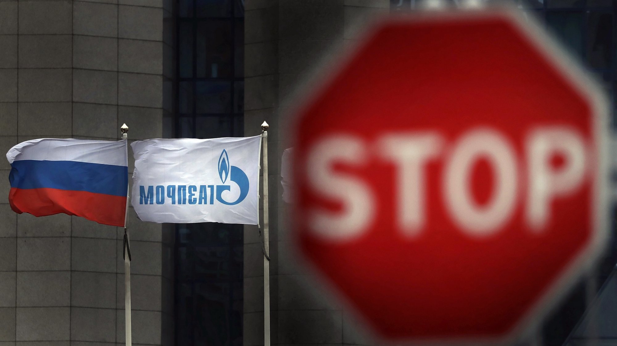 epa08147767 Flags wave outside of the Russian Gazprom company&#039;s headquarters in Moscow, Russia, 21 January 2020. According to Gazprom&#039;s plans, the Nord Stream 2 natural gas pipeline from Russia to Germany should be completed at the beginning of 2021, despite US sanctions against companies laying pipes for the natural gas pipeline.  EPA/MAXIM SHIPENKOV