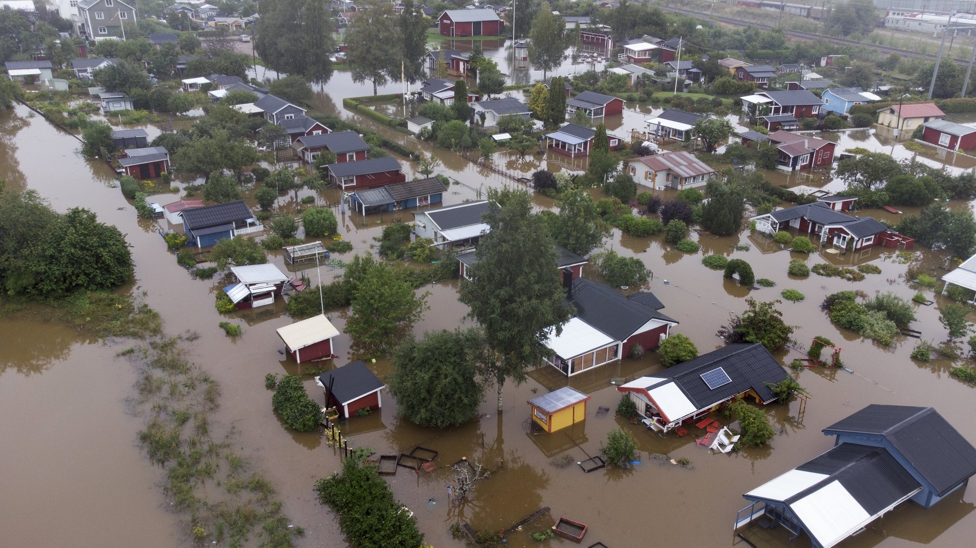 epa09418718 An aerial view over a flooded residential area at Sodra Kungsvagen in Gavle, Sweden, 18 August 2021. Due to heavy rains in eastern Sweden, several roads and viaducts are flooded.  EPA/Fredrik Sandberg  SWEDEN OUT