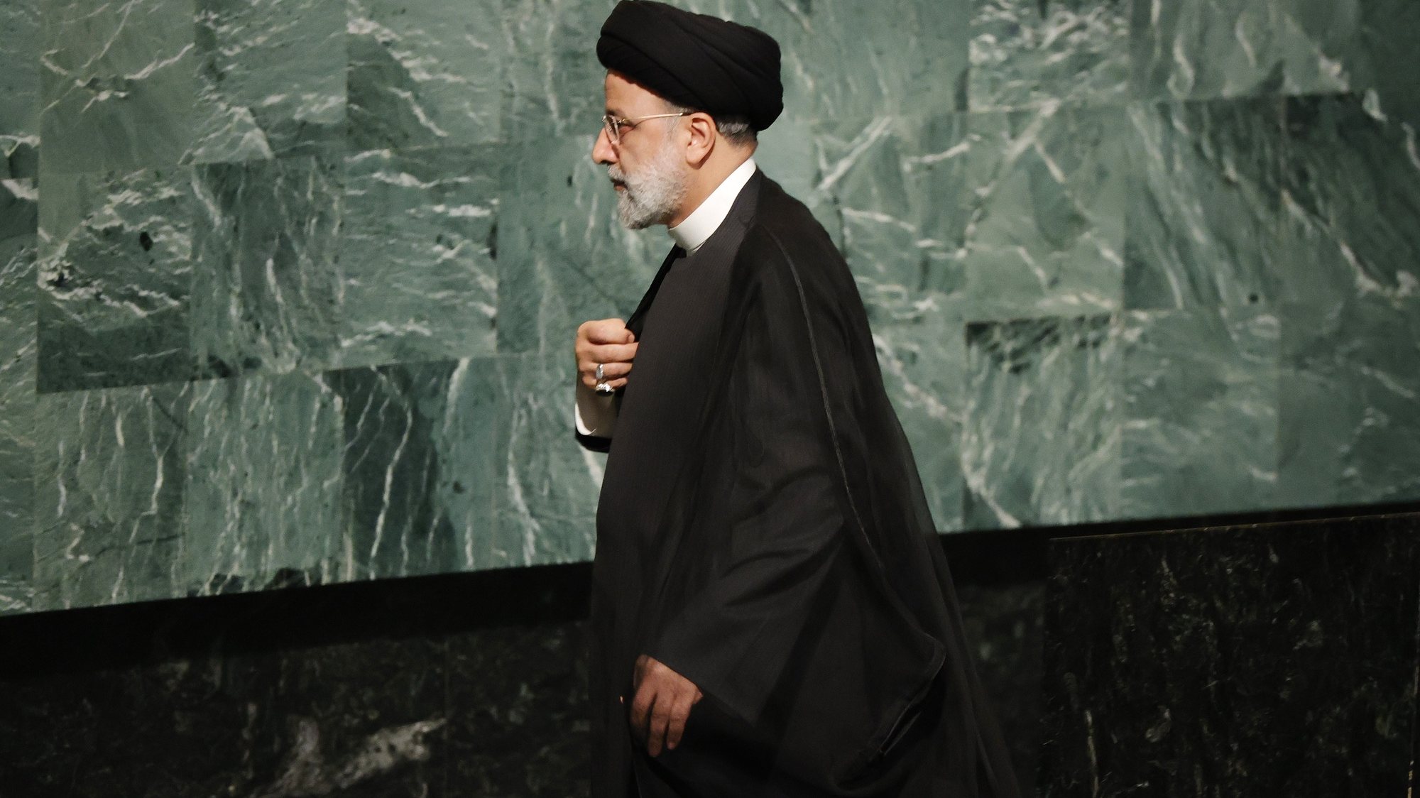 epa10196914 President Seyyed Ebrahim Raisi of Iran departs after delivering his address during the 77th General Debate inside the General Assembly Hall at United Nations Headquarters in New York, New York, USA, 21 September 2022.  EPA/JASON SZENES